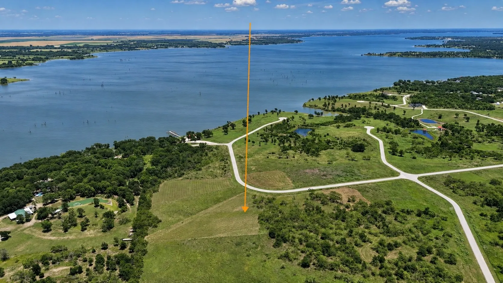 Enjoy glimpses toward Richland Chambers Lake from this premium homesite near the community entrance.