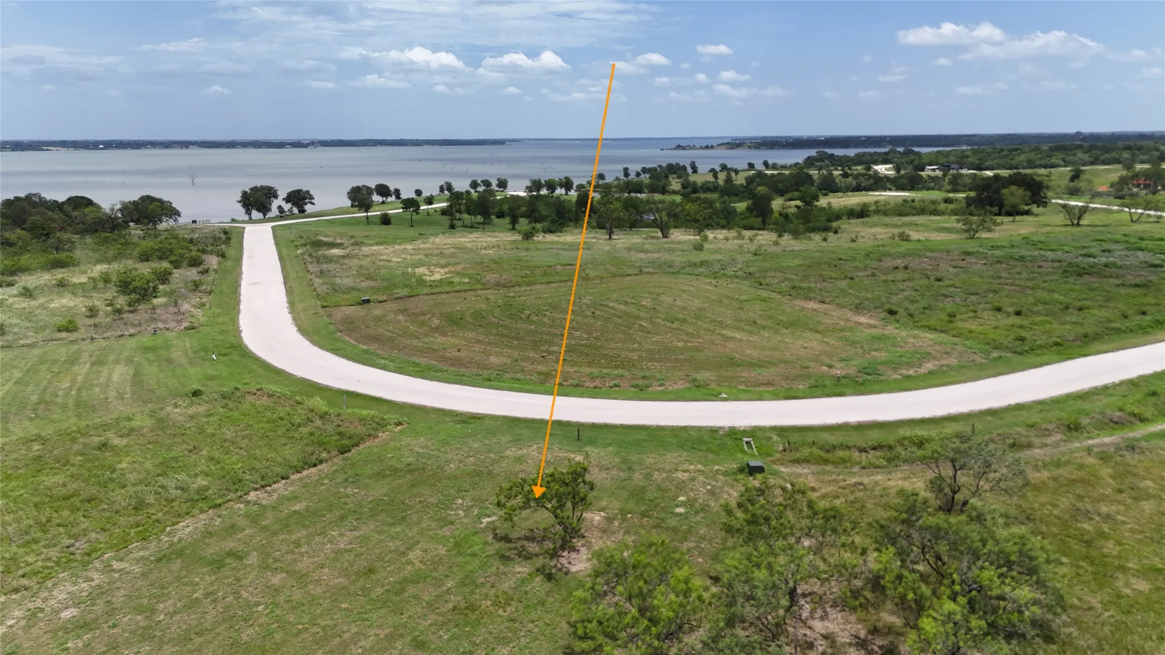 Elevated aerial showcases the homesite with Richland Chambers Lake just beyond the neighborhood.