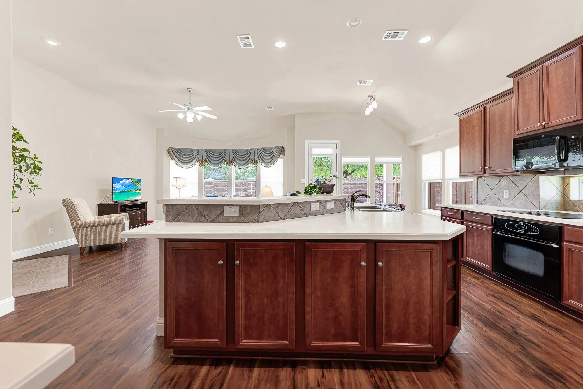 The heart of the home, this expansive kitchen features a large center island with seating, abundant prep space, and an open design that keeps you connected to the living and dining areas while entertaining.