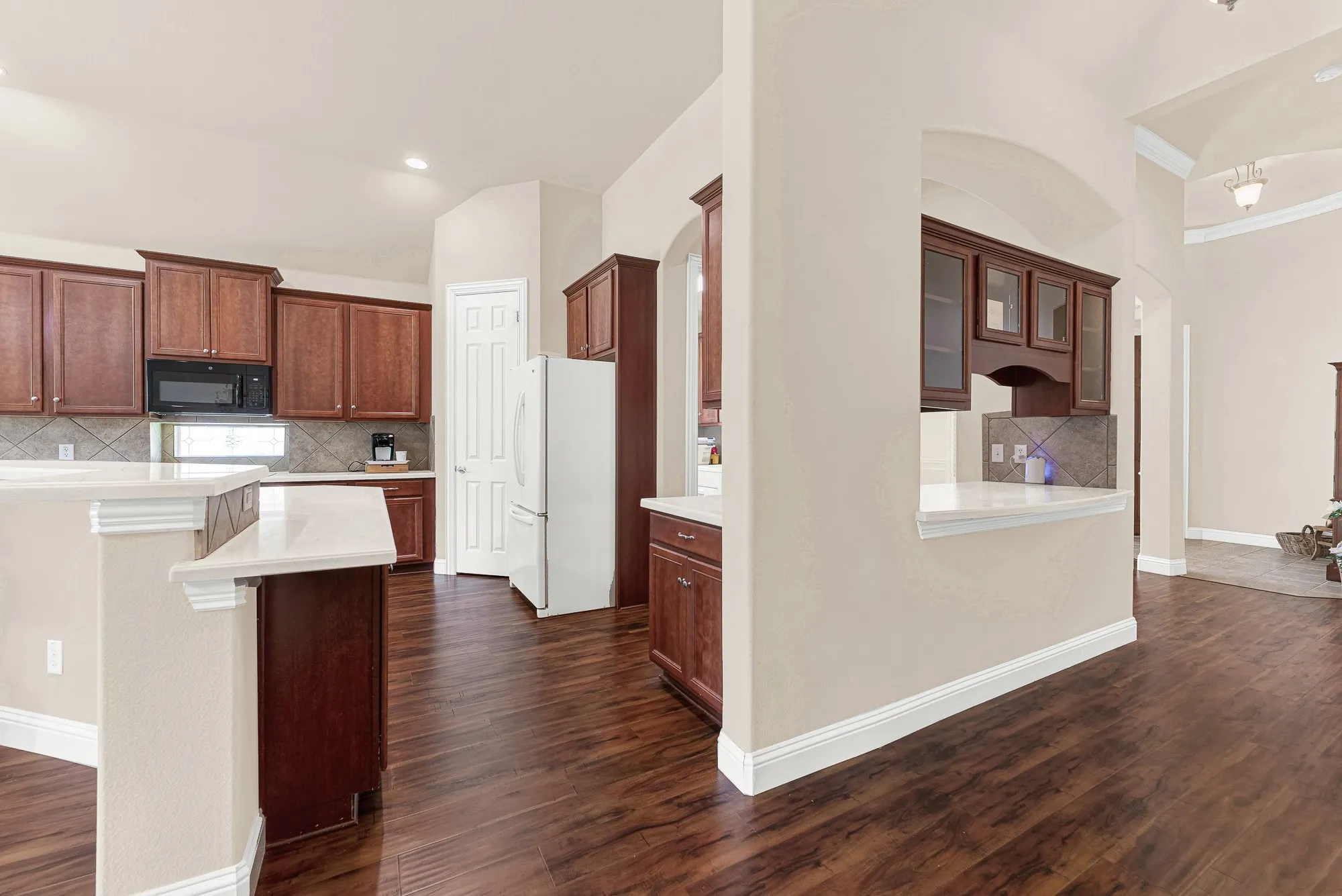 A convenient butler's pantry provides additional storage, serving space, and organization—an elegant feature that's perfect for entertaining or everyday convenience.