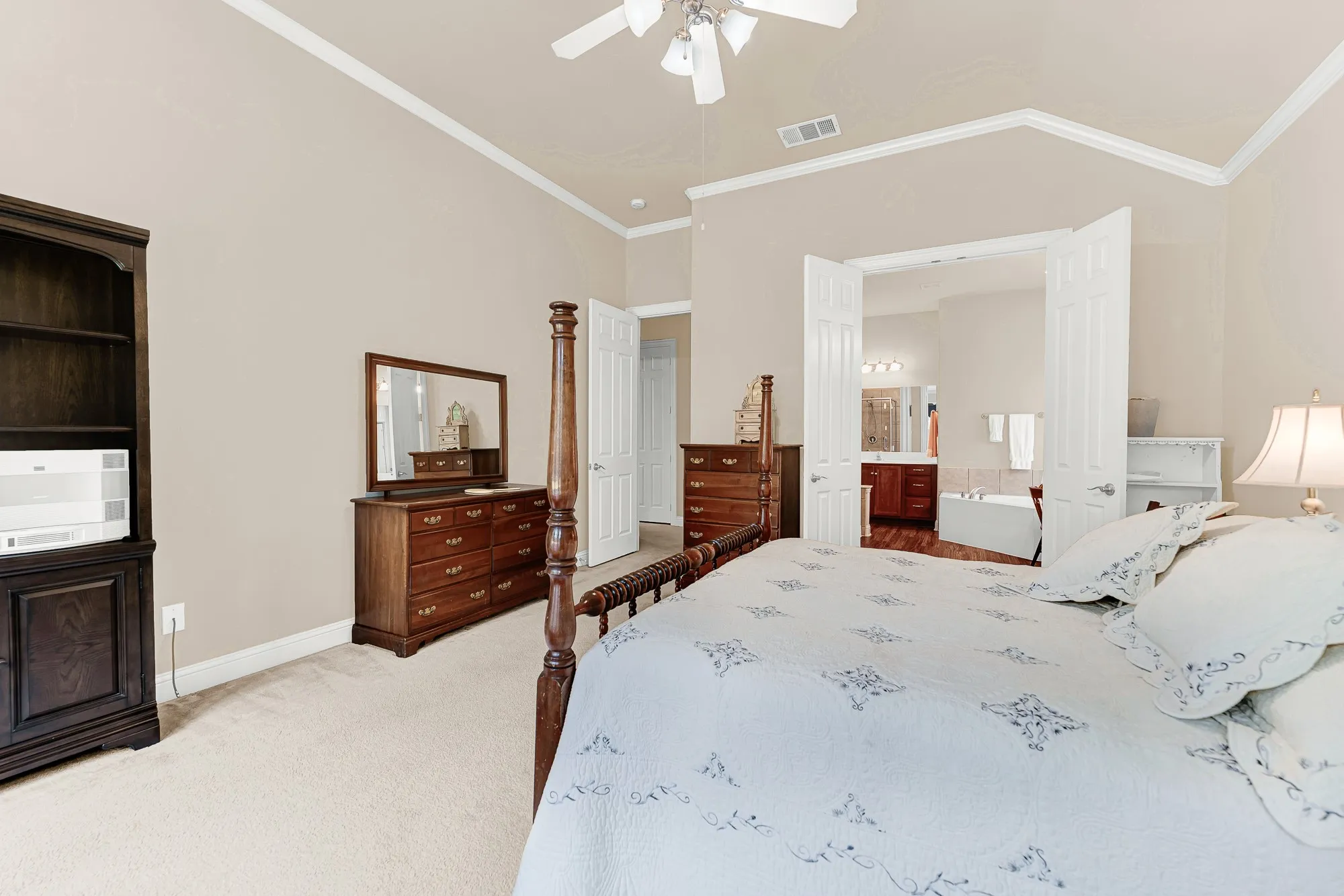 Wake up in comfort with a generously sized primary suite that flows seamlessly into the spa-inspired bath, offering privacy and a true owner's retreat.