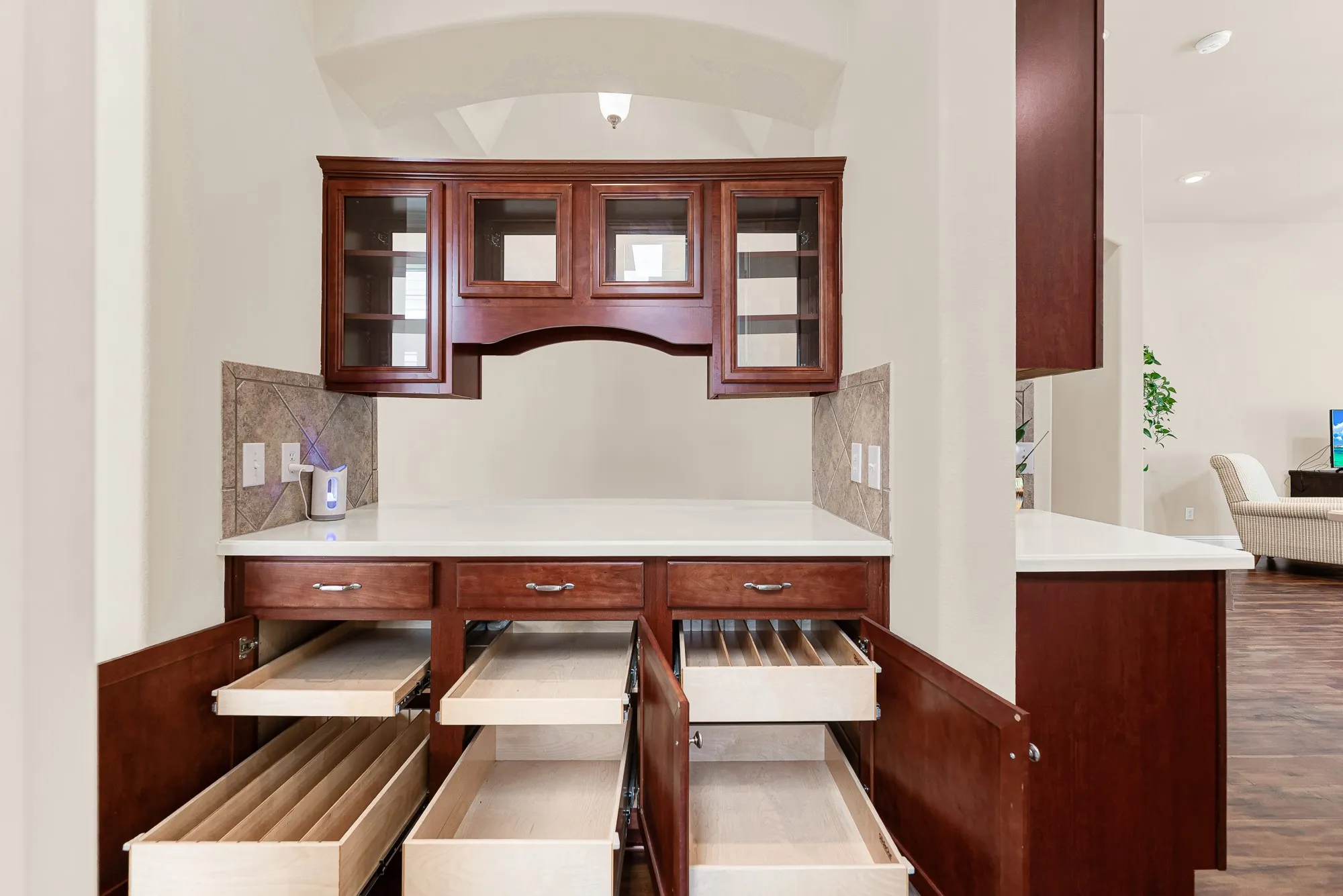 Thoughtfully designed with pull-out shelving, drawer organizers, display cabinetry, and expansive workspace, the butler's pantry offers outstanding organization and functionality that elevates everyday living.