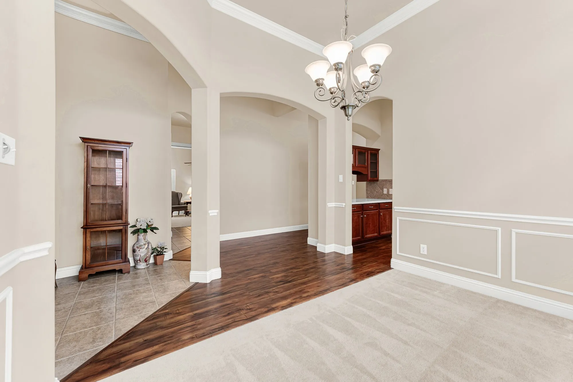 Perfect for entertaining or holiday gatherings, this spacious formal dining room seamlessly connects to the butler's pantry and kitchen while offering sophisticated finishes and an open, airy feel.