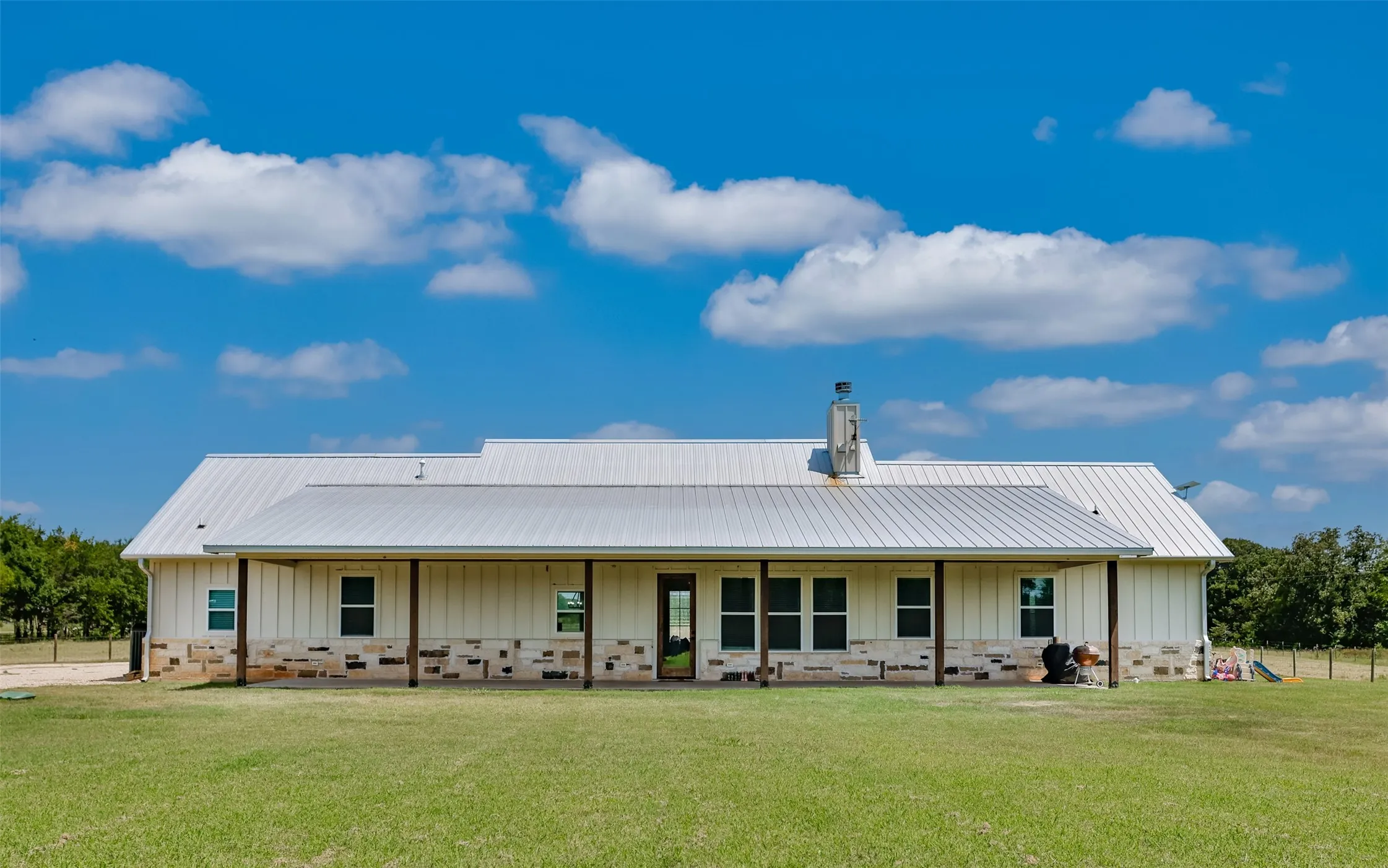 Huge covered back porch spans almost the entire back