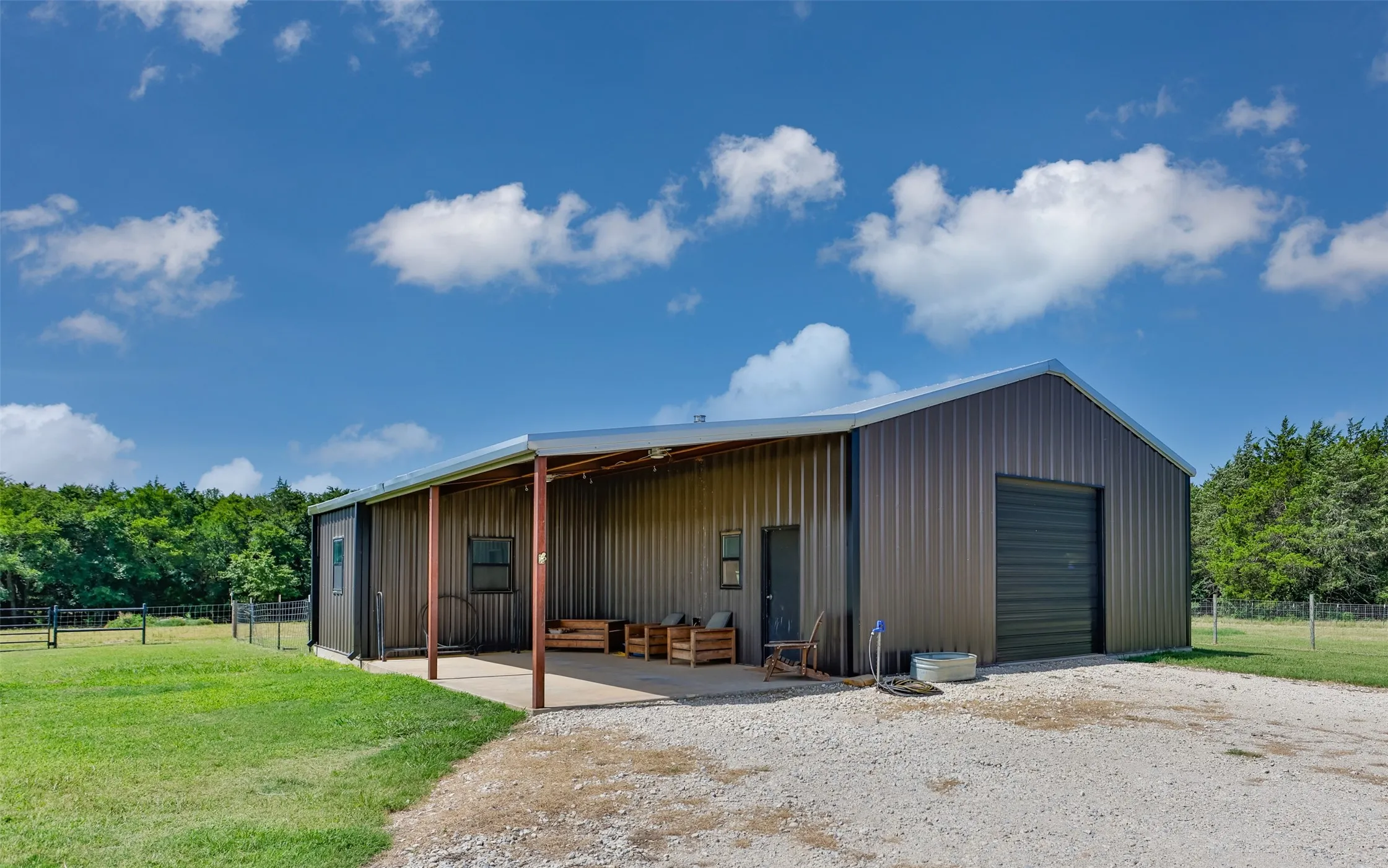 1410sf shop with an added overhang carport area.