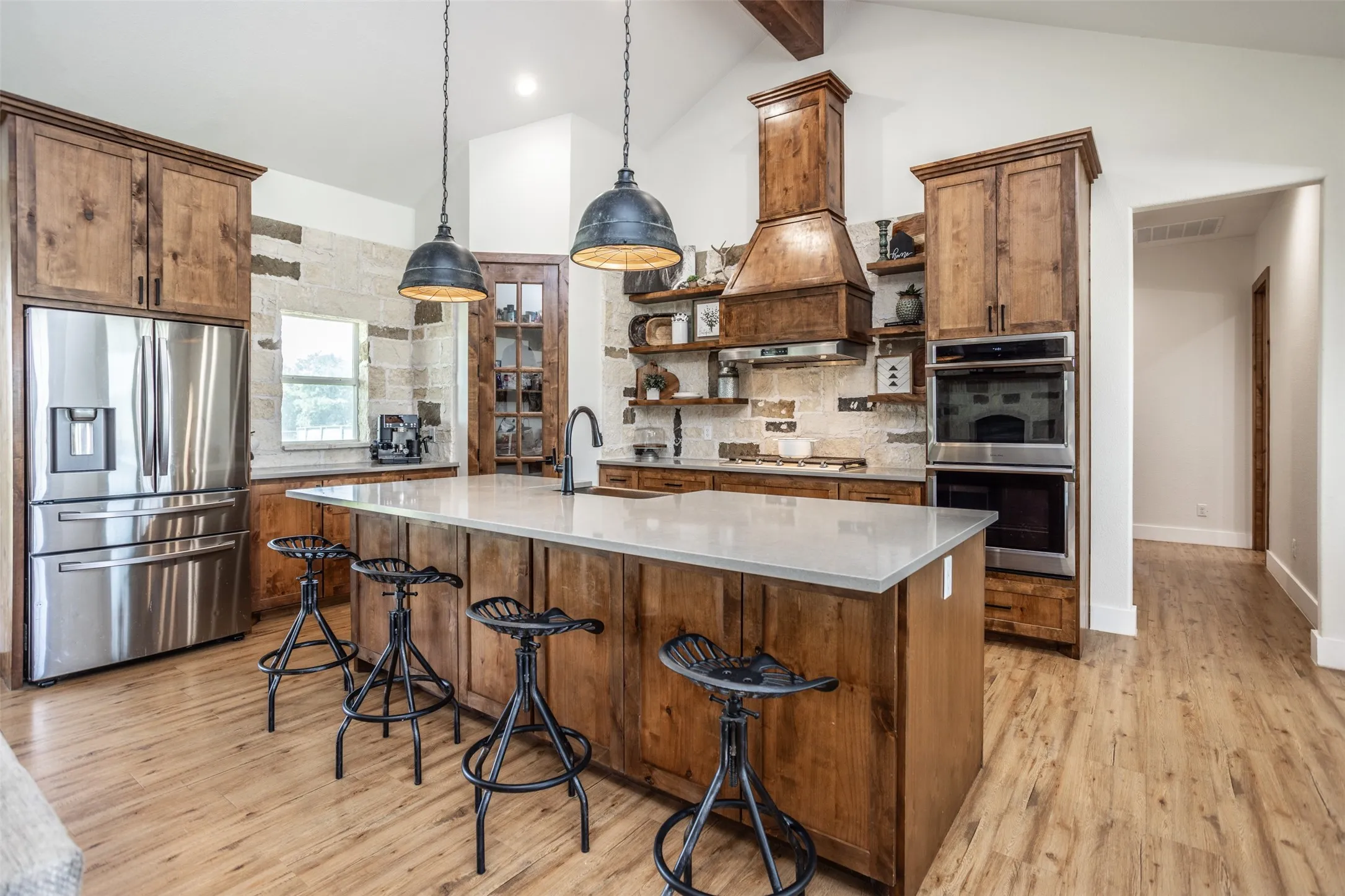 Kitchen Island with decorative lighting and quartz counters