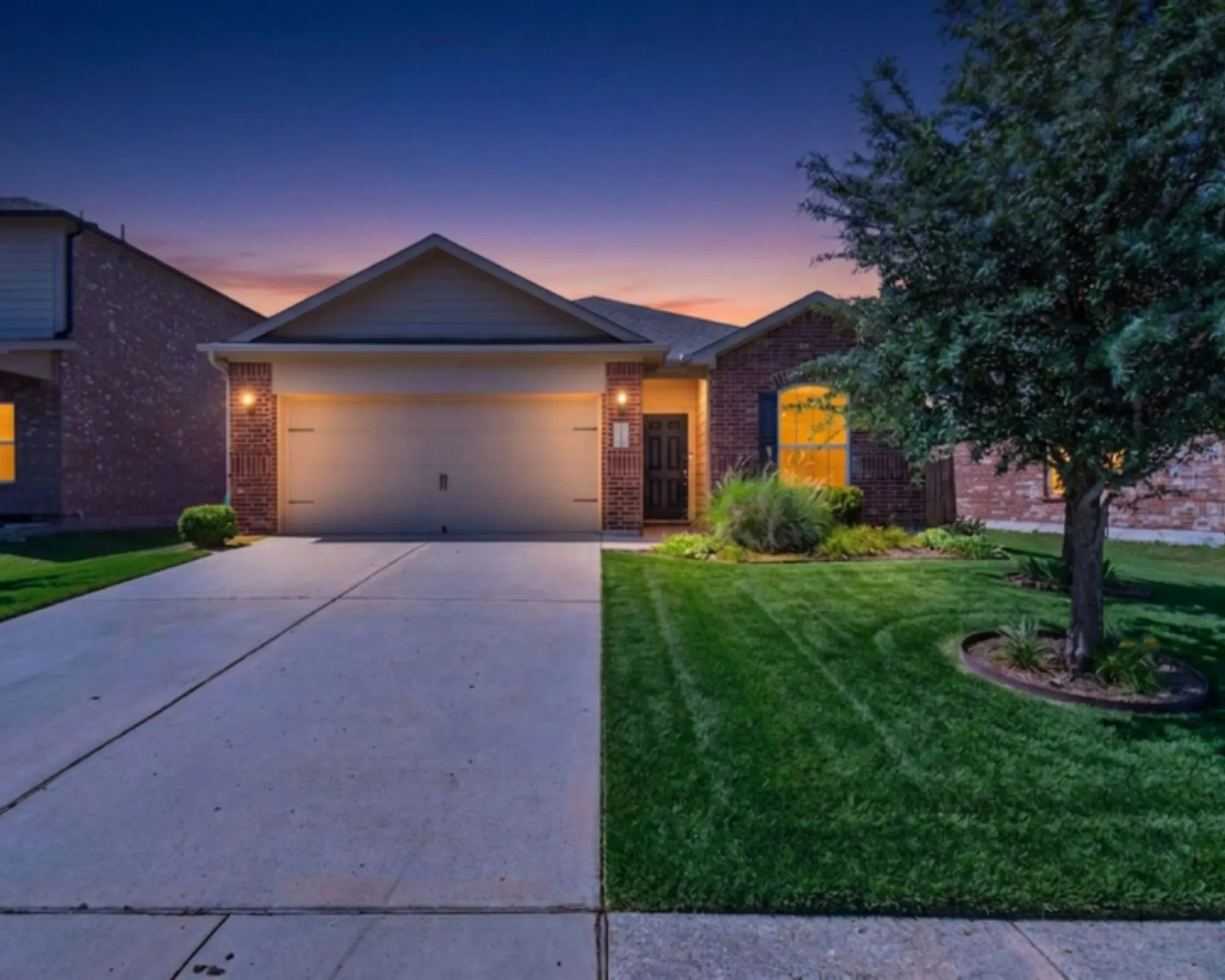 Single-story residence featuring a brick and siding exterior