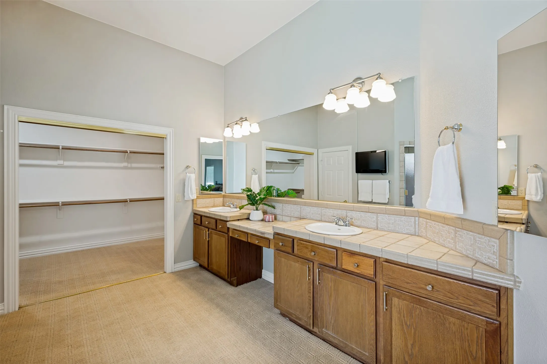 Double Vanity in the Primary Bath. Doors are off closet to be able to see it better.