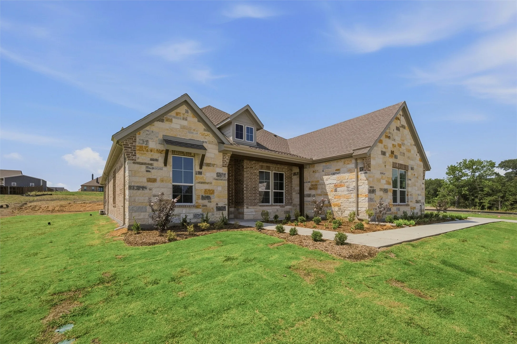 Stone and brick exterior with a prominent gabled roofline
