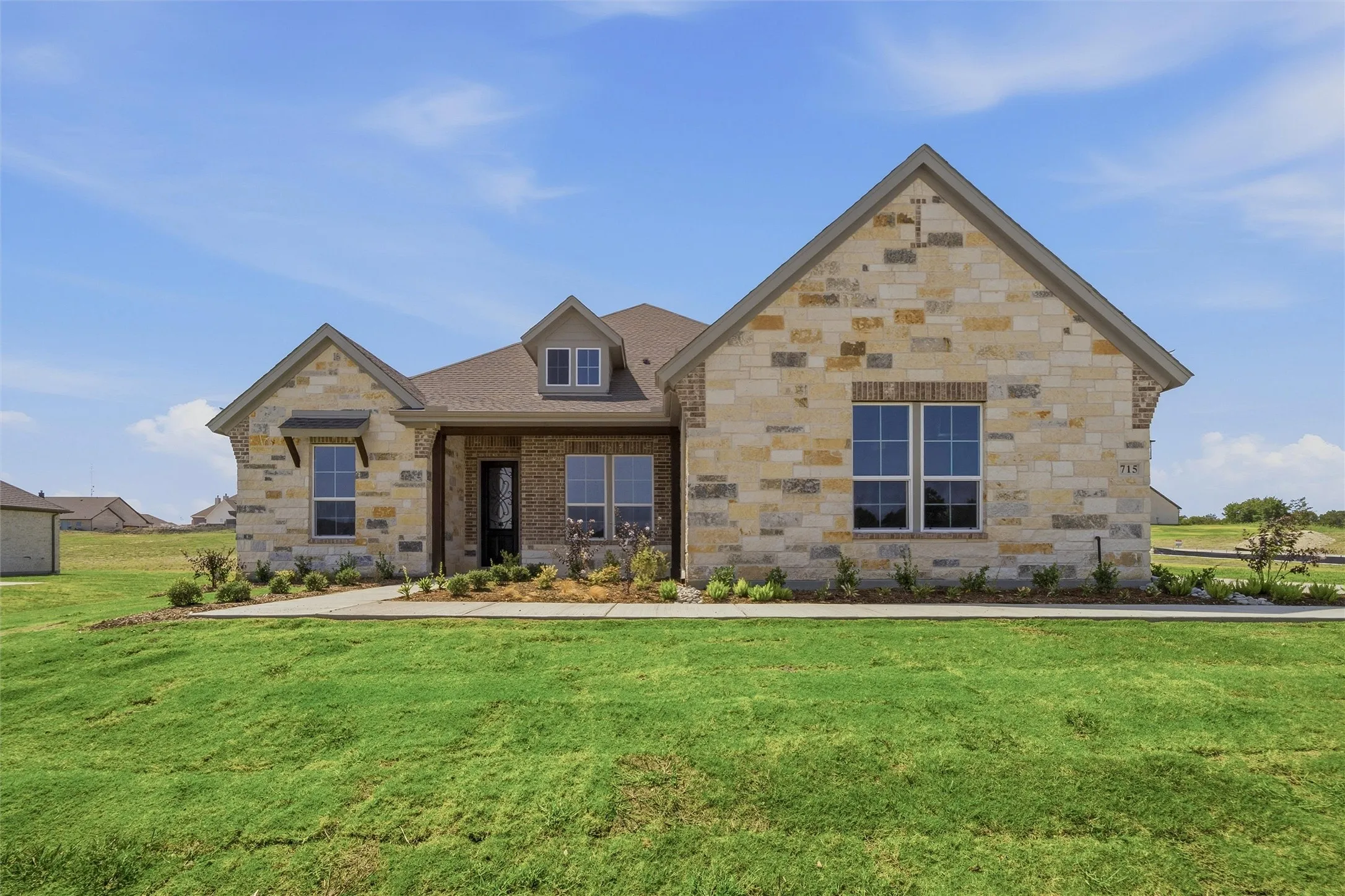Stone and brick exterior with a prominent gabled roofline