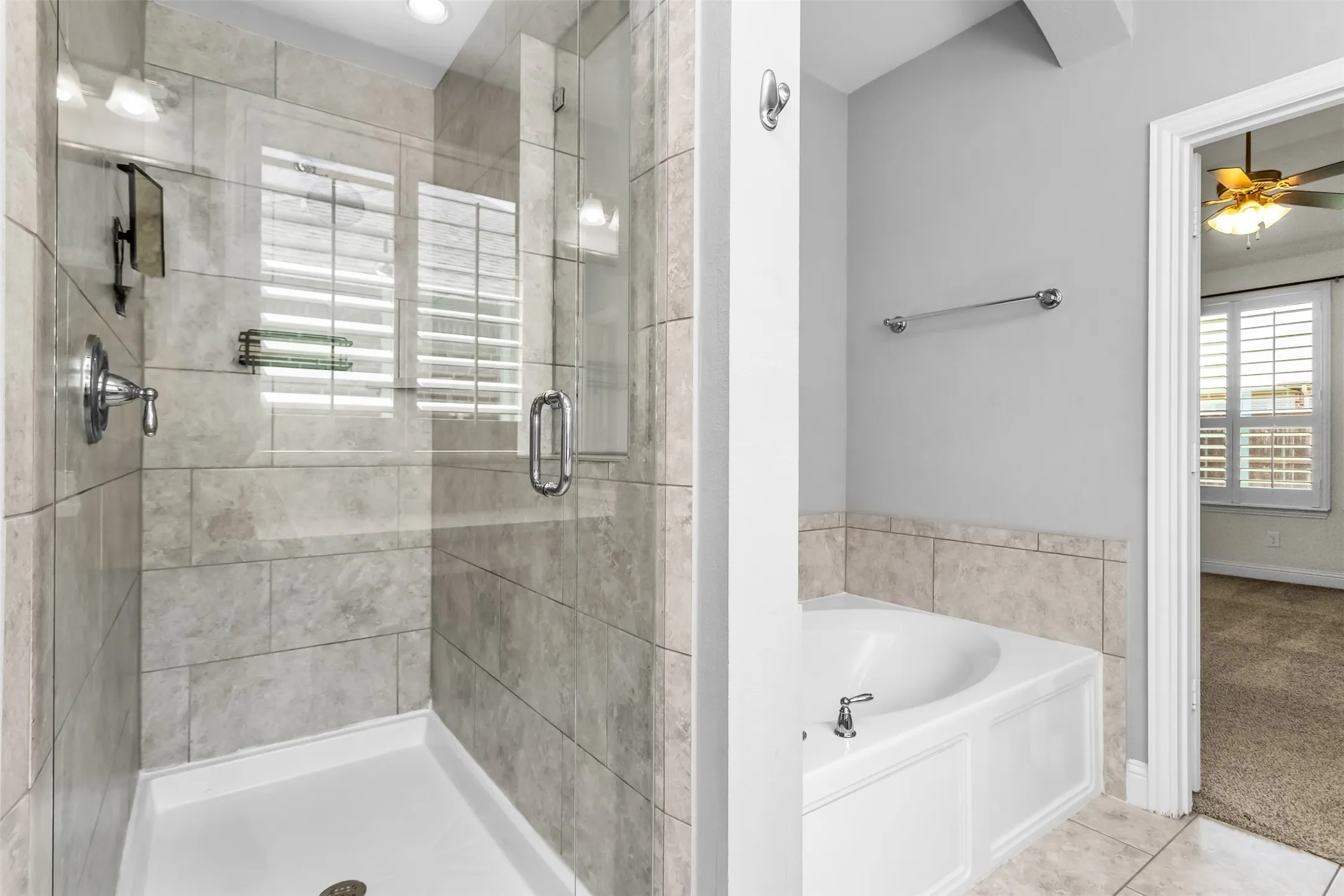 Walk-in shower with clear glass enclosure and chrome​​‌​​​​‌​​‌‌​‌‌​​​‌‌​‌​‌​‌​​​‌​​ fixtures