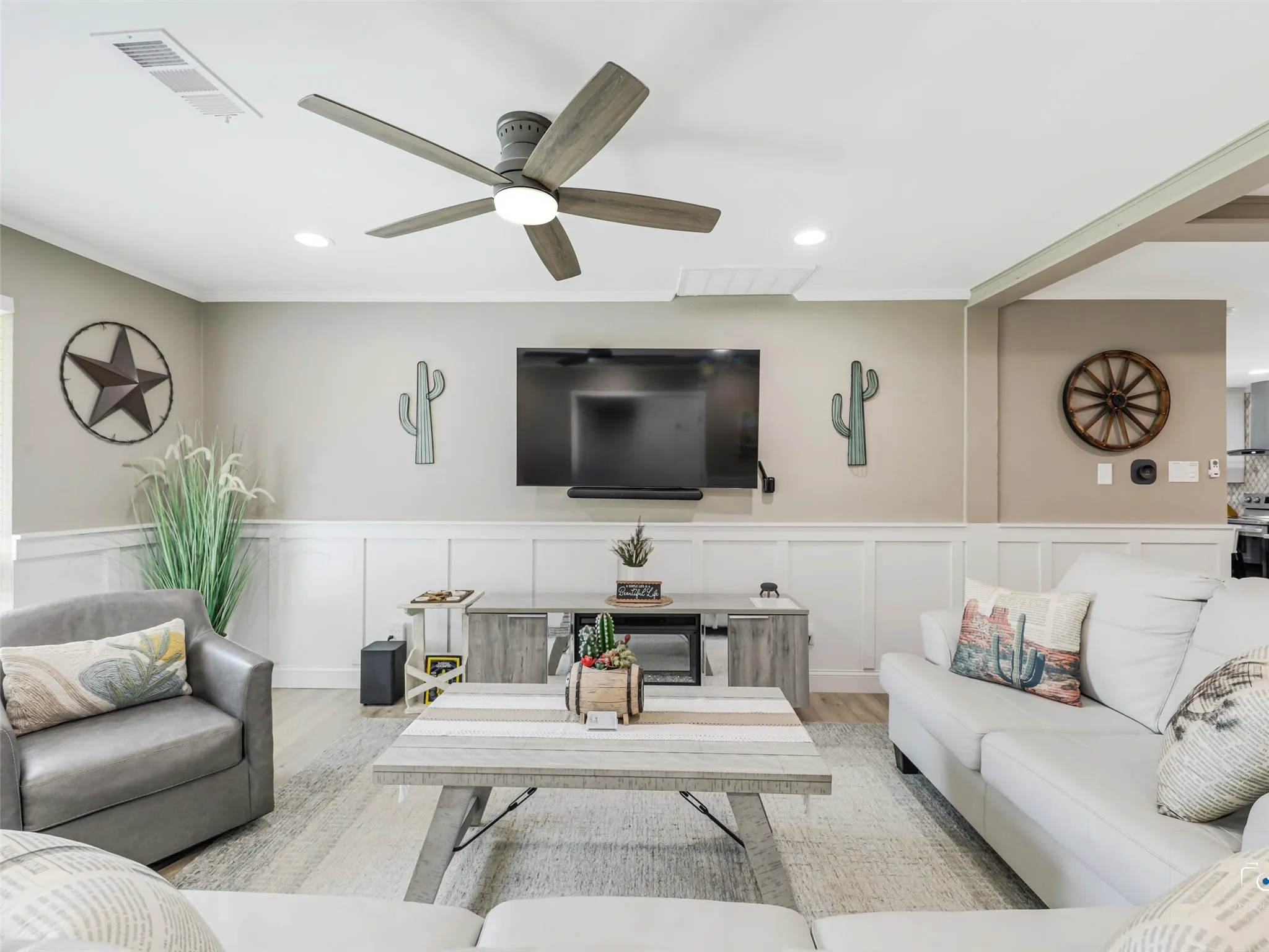 Large living area with wainscoting accented walls
