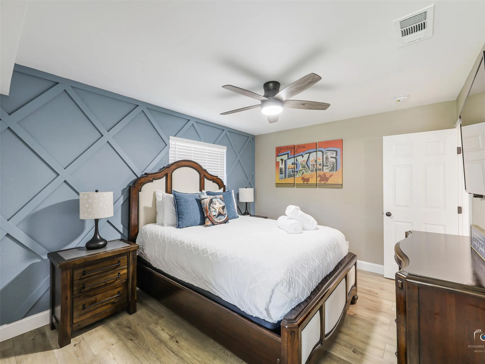 Primary bedroom with designer accent wall