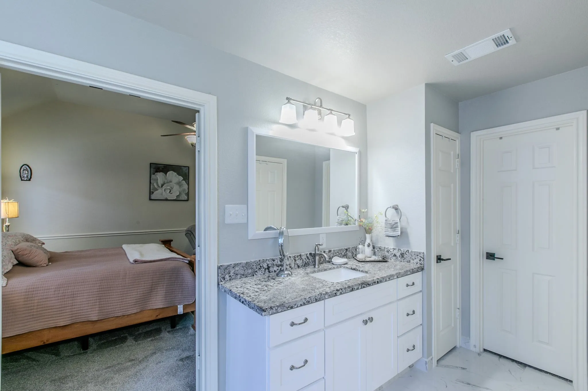 sep vanity area in primary w walk in closet