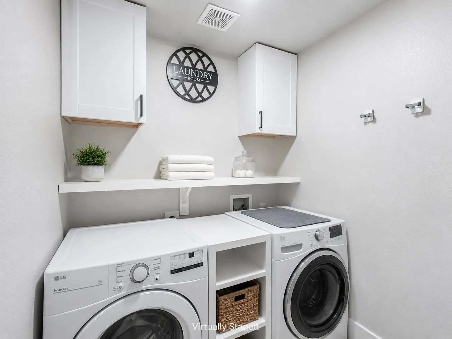 laundry room w shelf and cabinets.