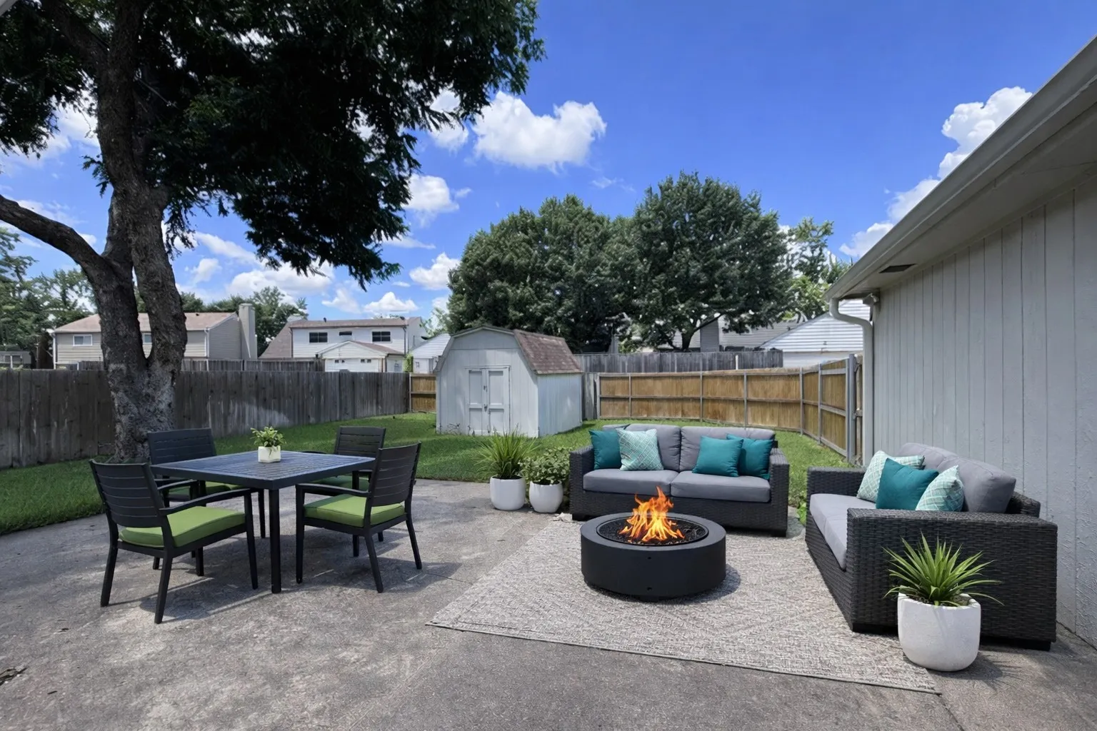 Expansive concrete patio area with a privacy fence