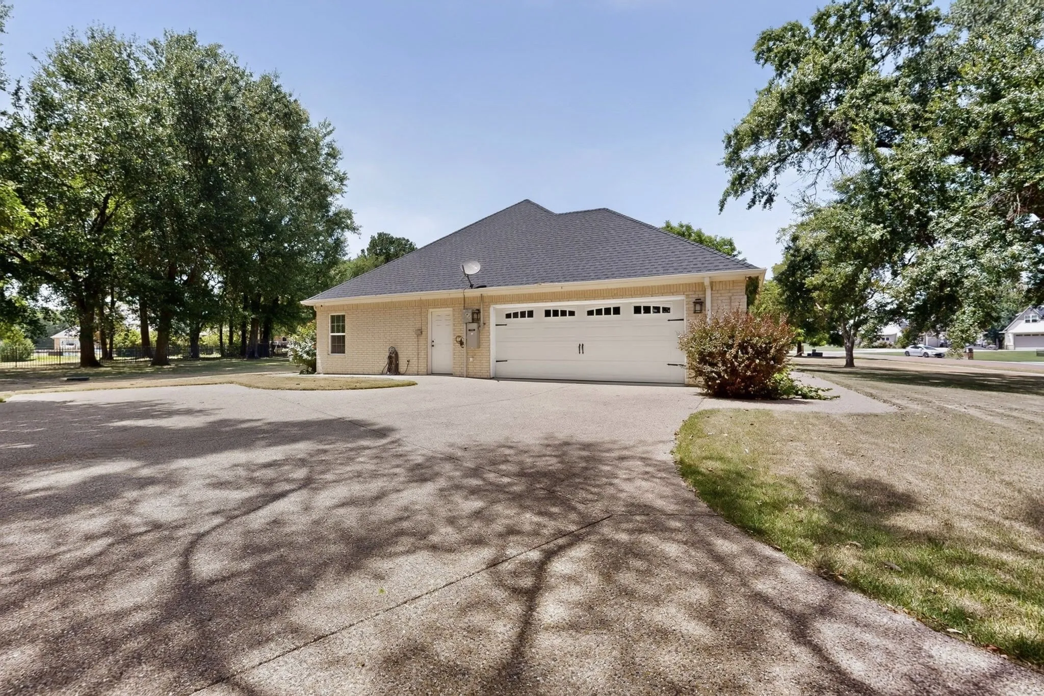 Expansive concrete driveway providing ample parking