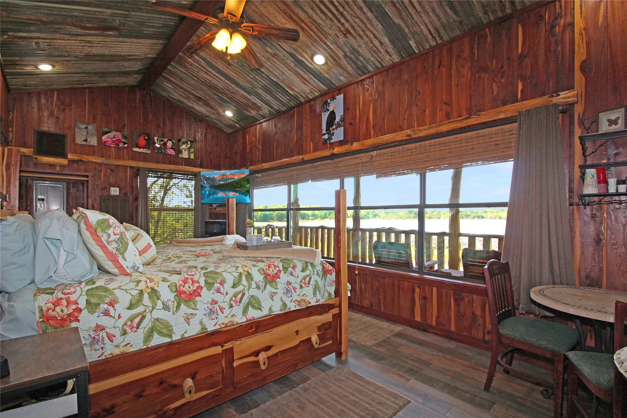 Vaulted wood-paneled ceilings with recessed lighting and a ceiling fan