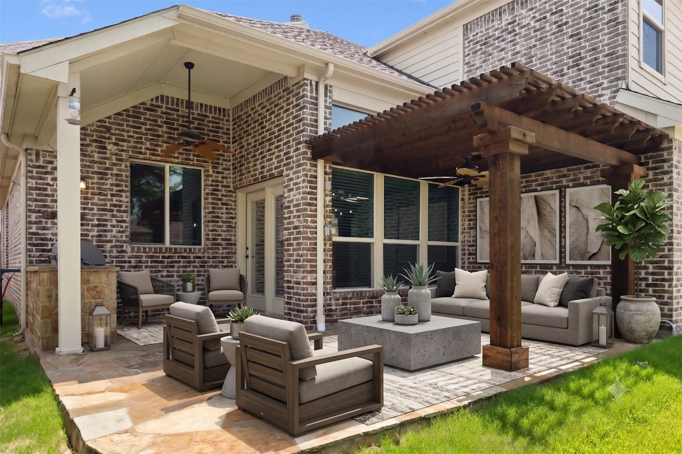 Virtually staged - Expansive stone paver patio featuring a wooden pergola and a covered outdoor living area