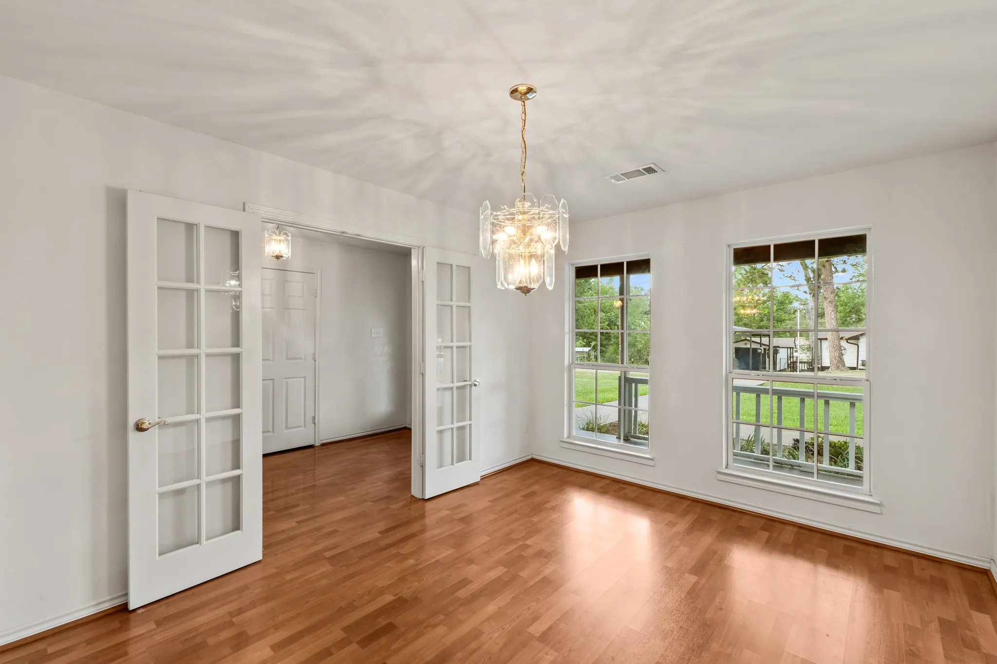 Separate formal dining room with double doors opening to the entry.