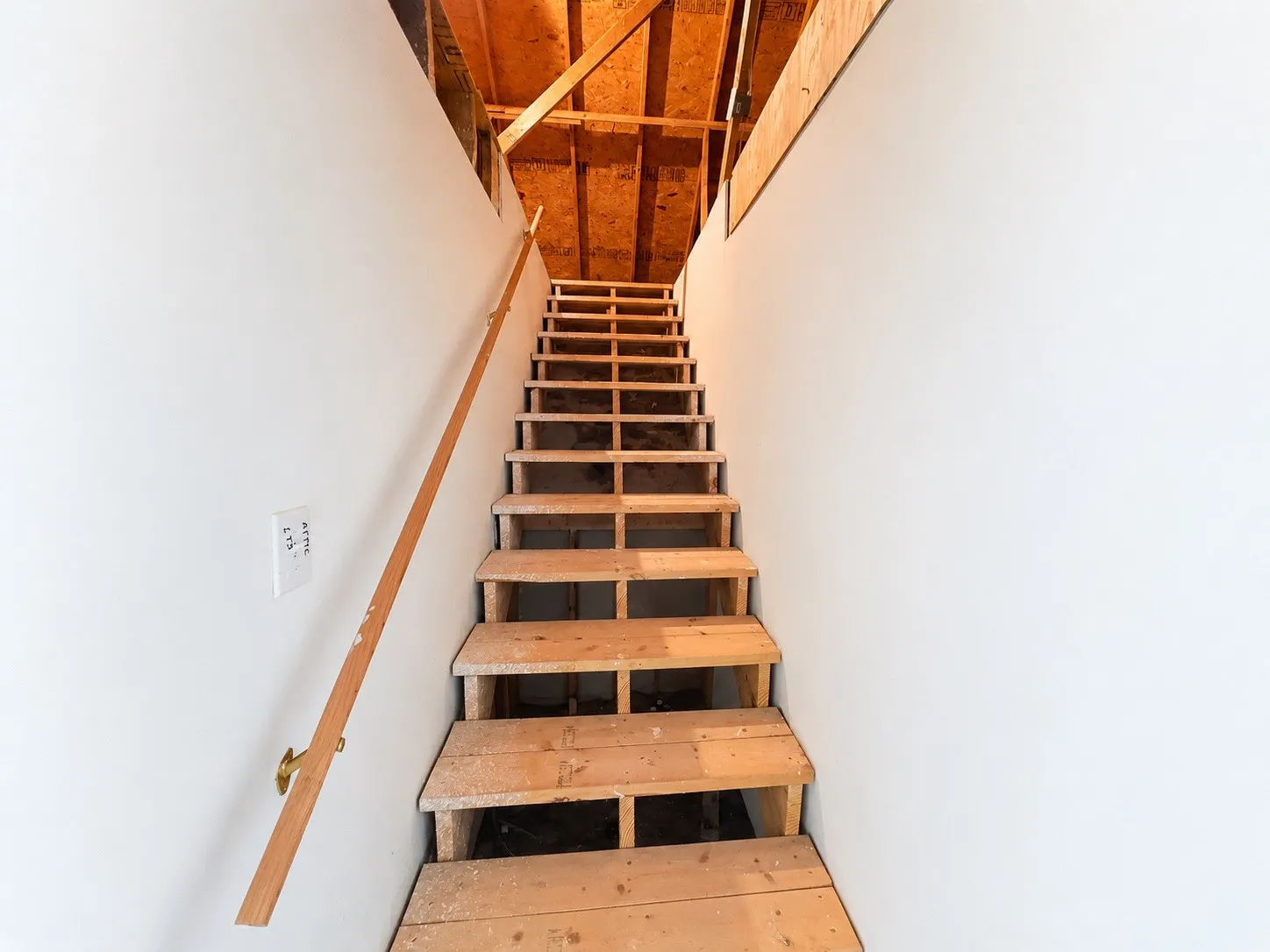 Attic stairwell leading to attic. Access through garage.