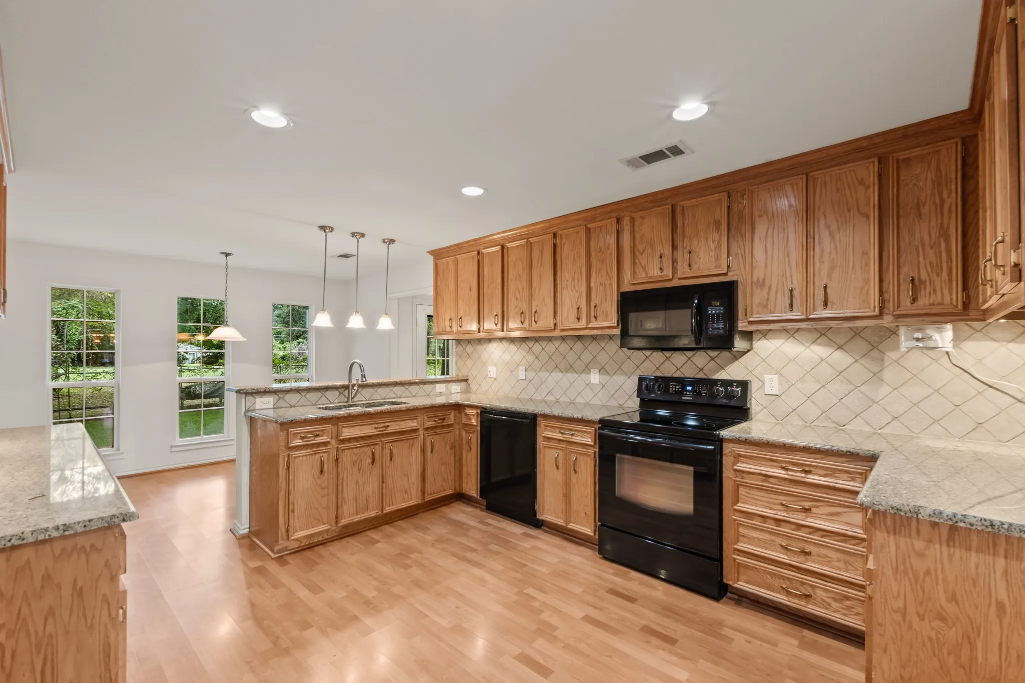 Functional kitchen complete that flows into the breakfast nook.