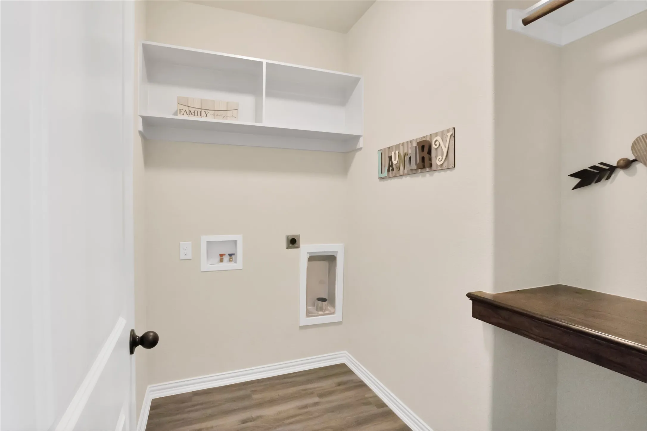 Laundry has hanging and folding space!