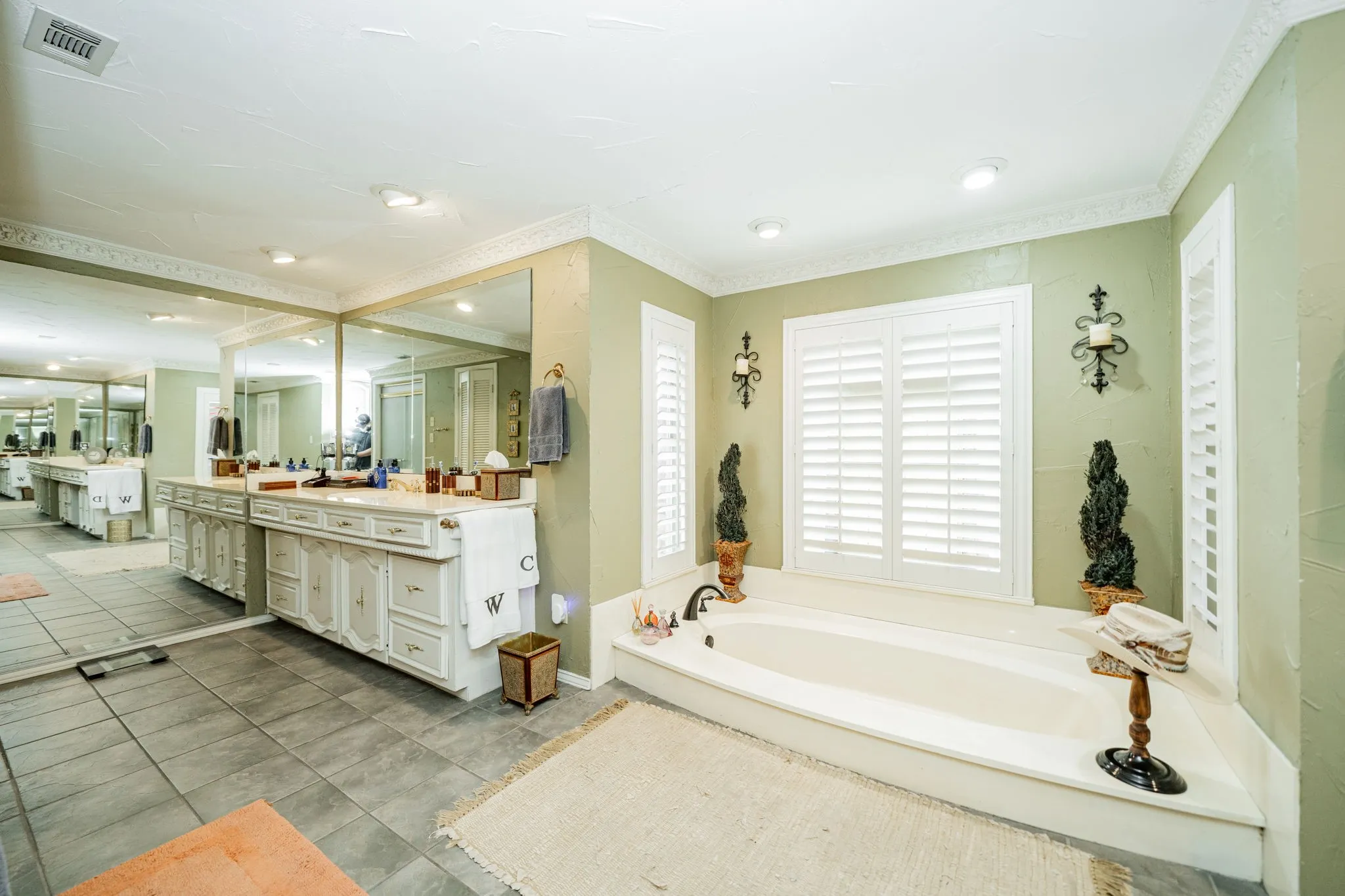 Full bath featuring vanity, a bath, crown molding, light tile patterned floors, and recessed lighting
