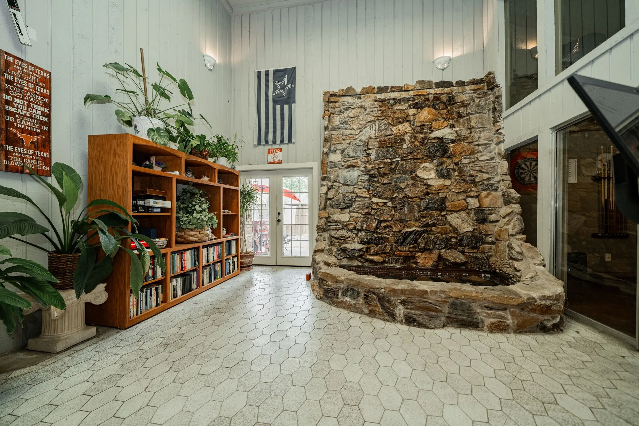 Living area with french doors and water fall