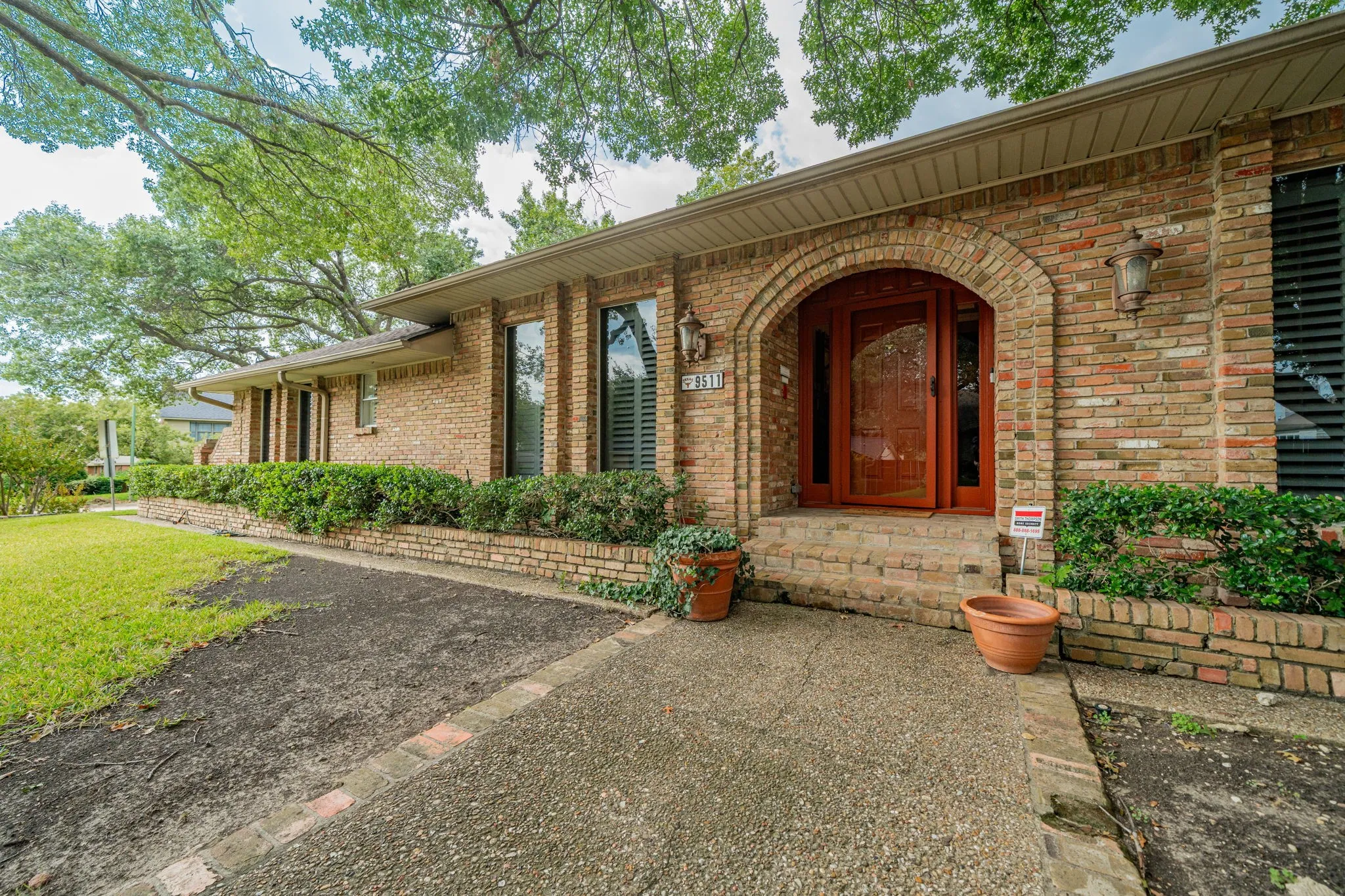 View of exterior entry with brick siding