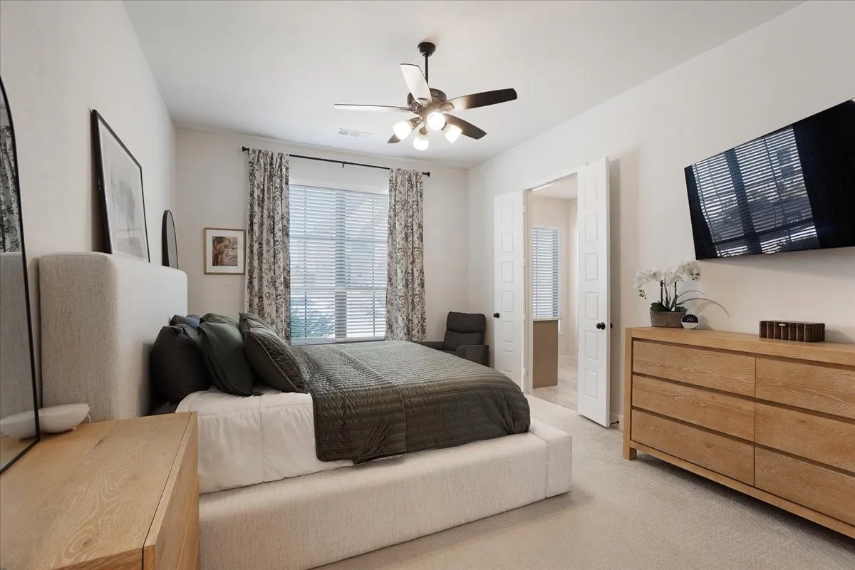 The primary has upgraded carpet and is located in the front of the home.