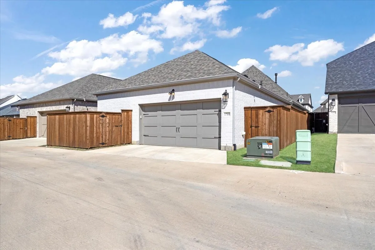 Rear view of the home and the garage.