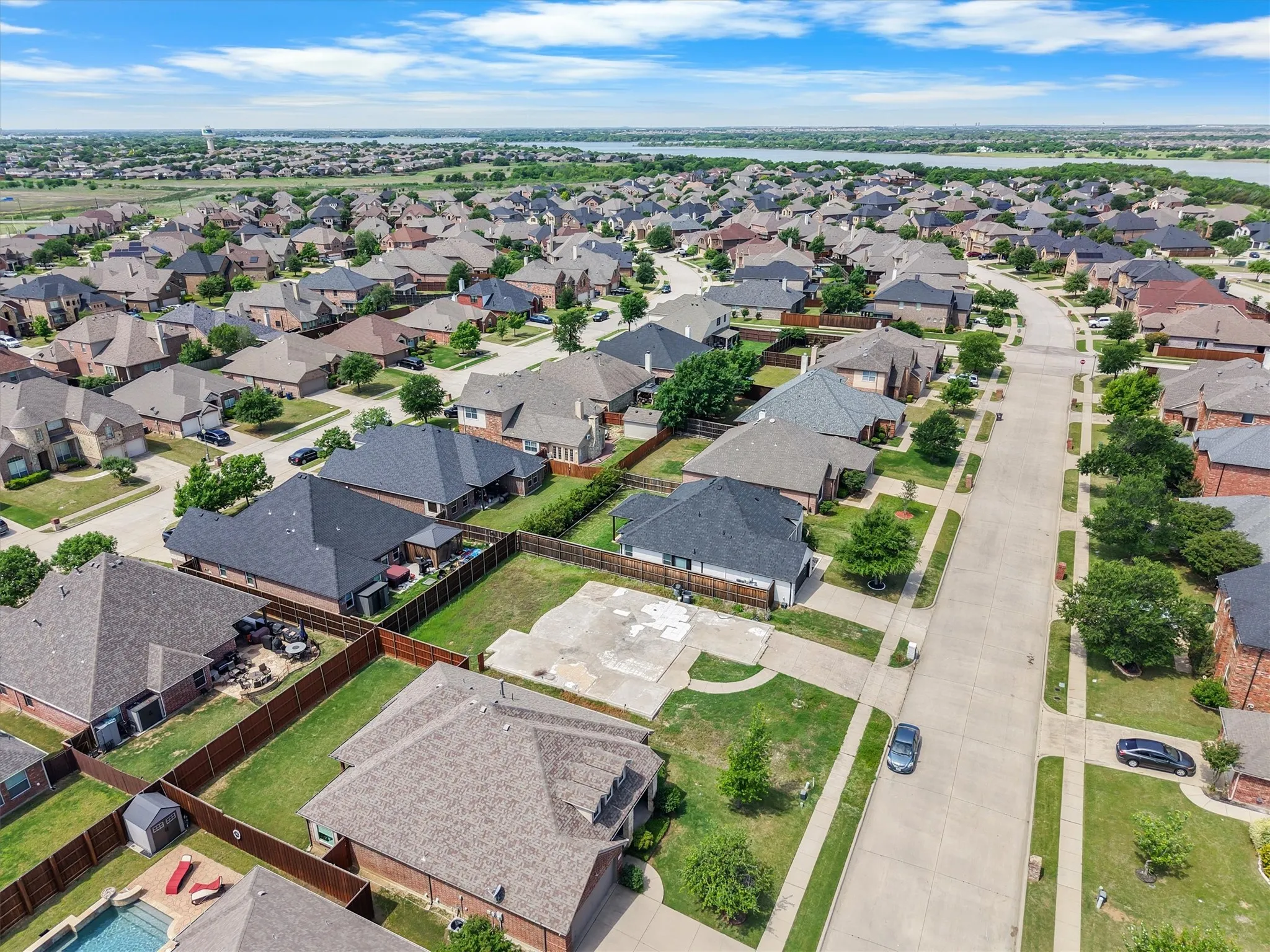 Expansive residential neighborhood featuring numerous single-story homes, mature landscaping, and an organized street grid