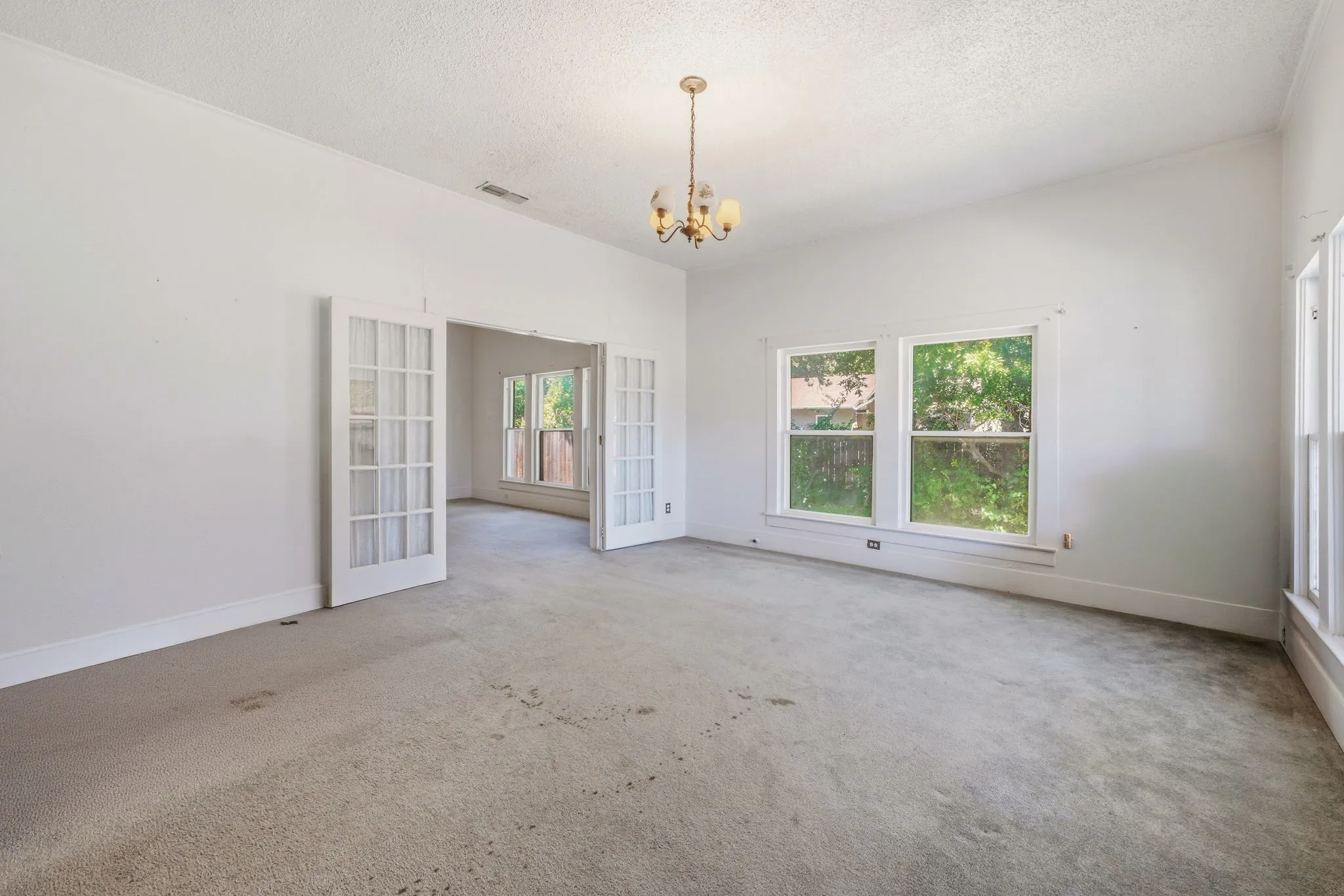 French doors to dining/second living area