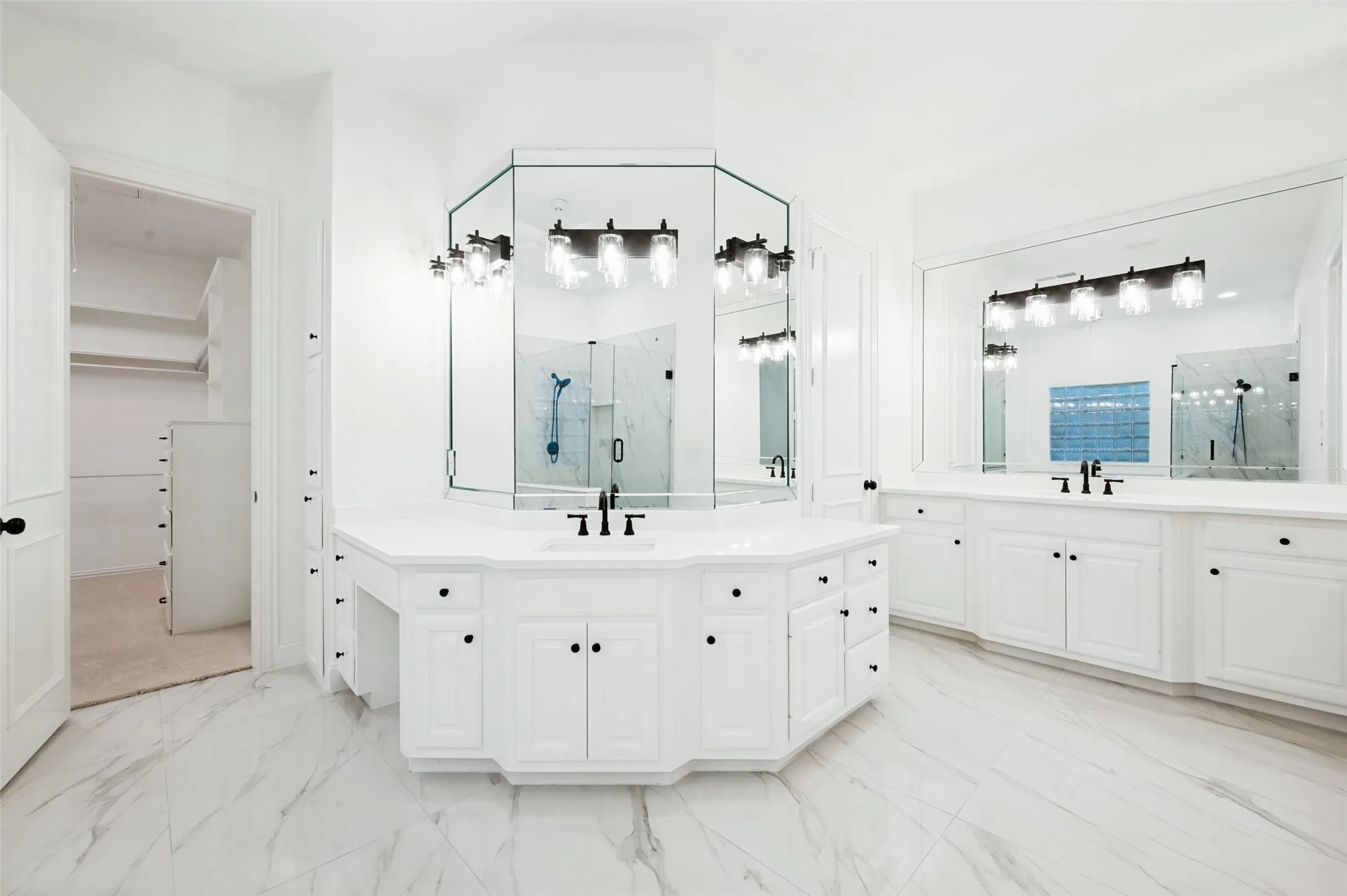 Primary Bathroom Spacious bathroom featuring double vanities.