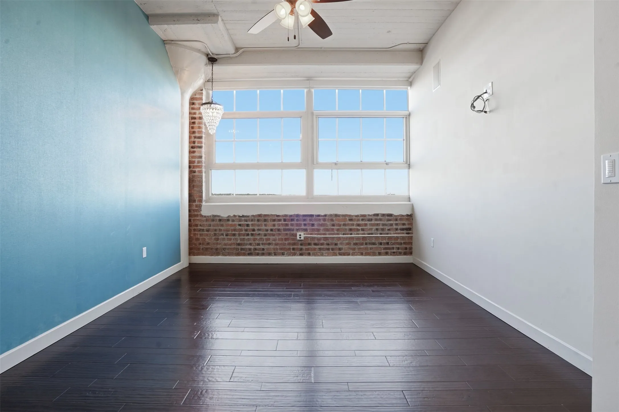 Expansive window array featuring multi-pane design and brick detailing