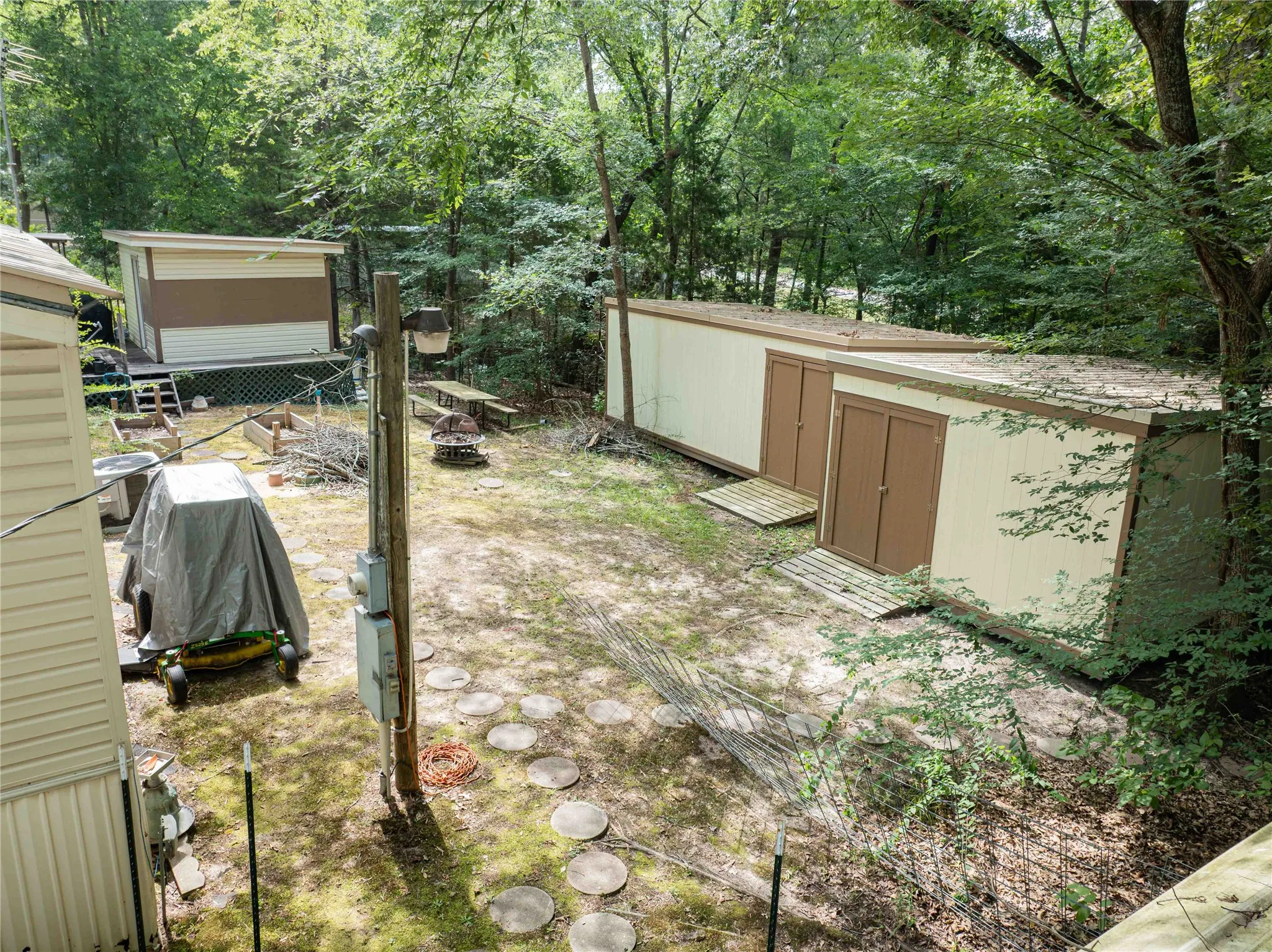 view of back of yard with storage buildings