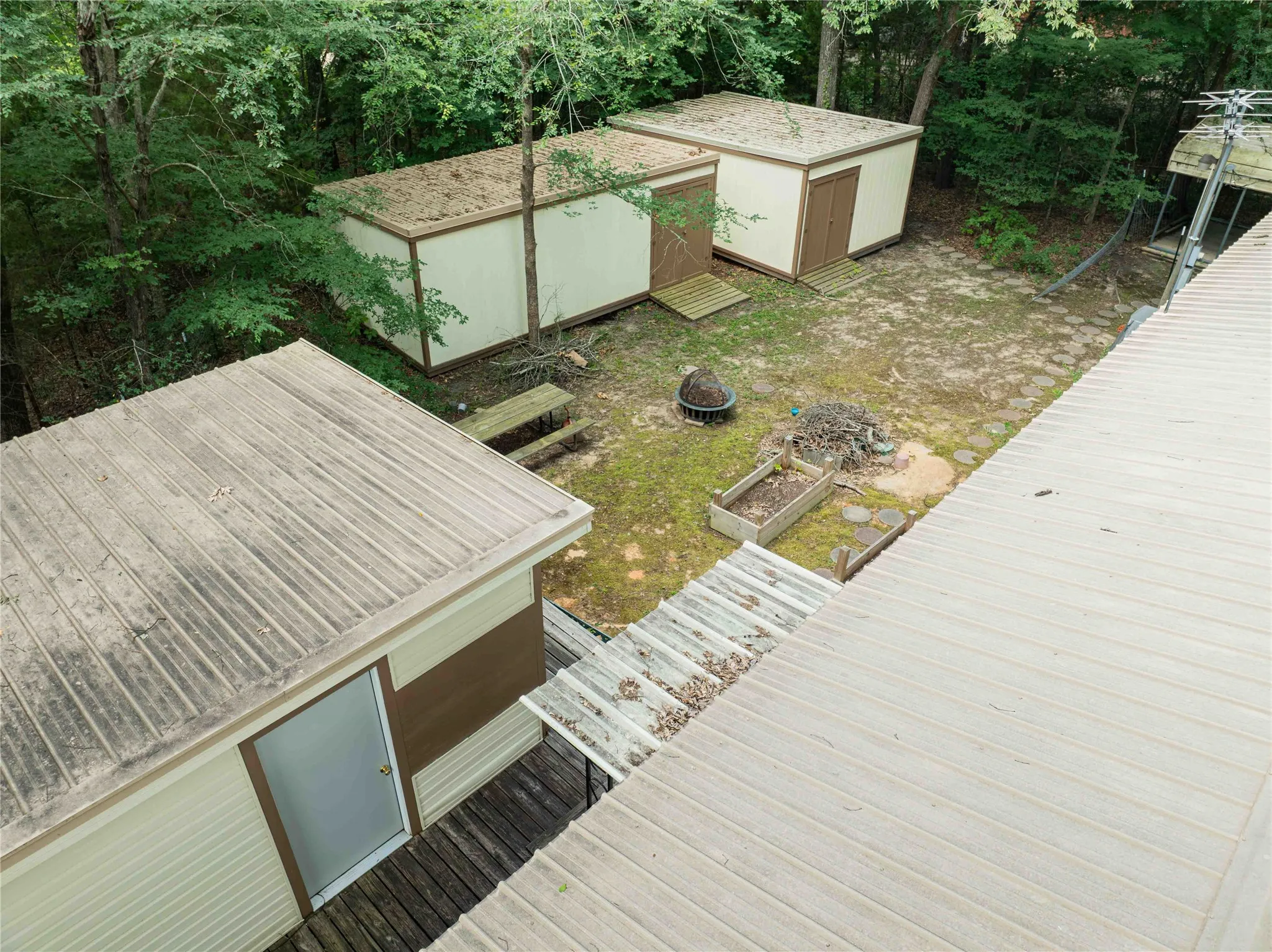 view of storage buildings in back yard