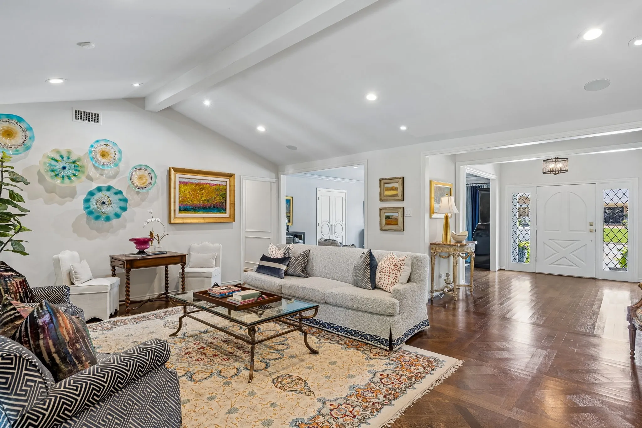 Family Room open to the Entry with Vaulted Beamed Ceiling and beautiful wood​​‌​​​​‌​​‌‌​‌‌​​​‌‌​‌​‌​‌​​​‌​​ floors.