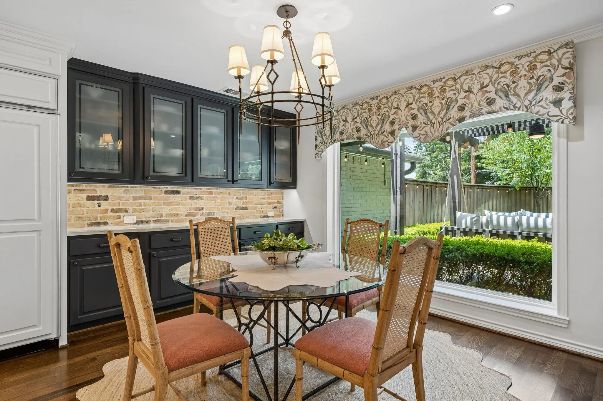 Breakfast Room with Built in China Cabinet and gorgeous picture window for views of back yard and patio area.