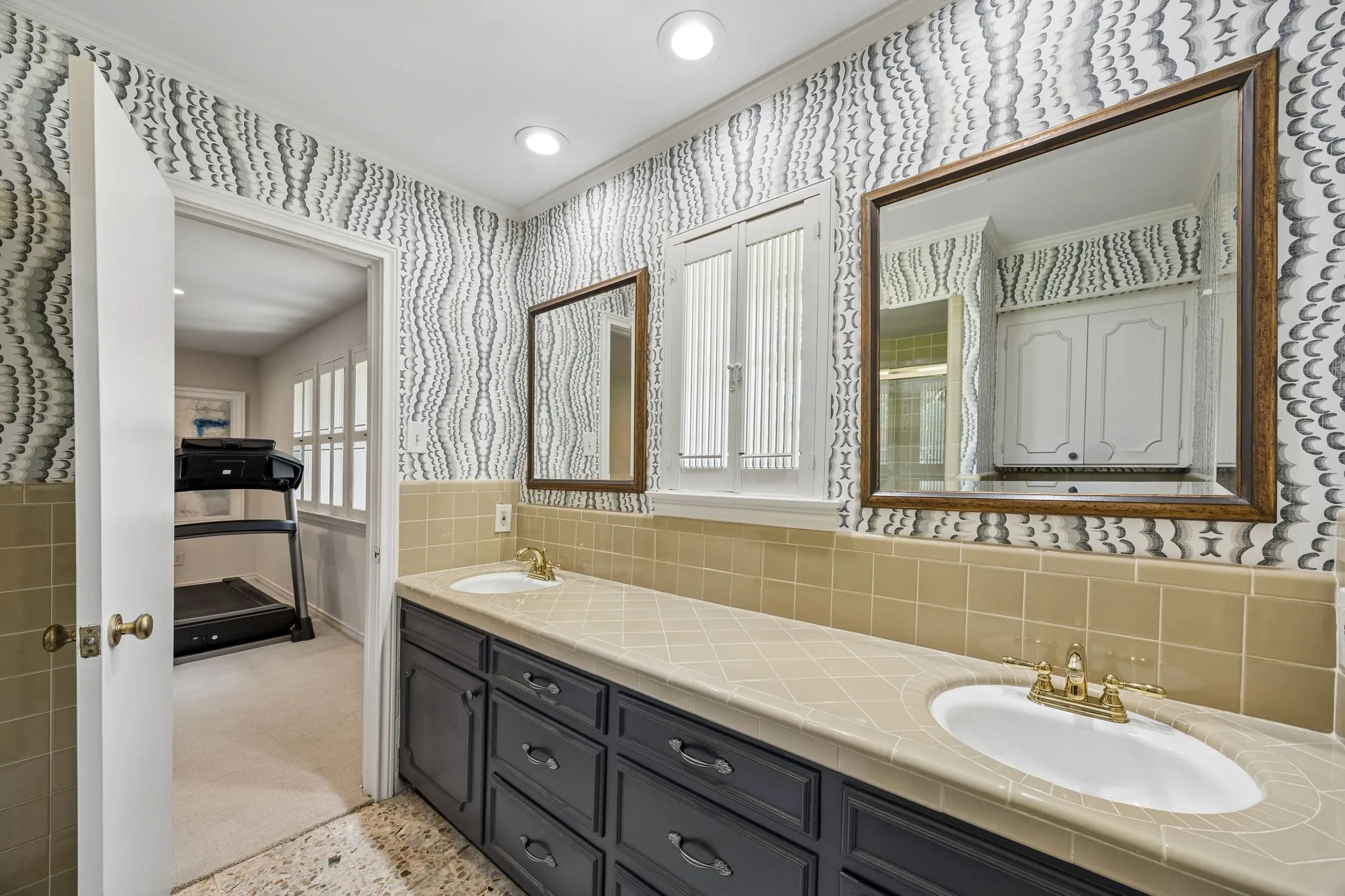 Jack and Jill Bath for Bedrooms 2 and 3 with dual sinks and tub shower combo.