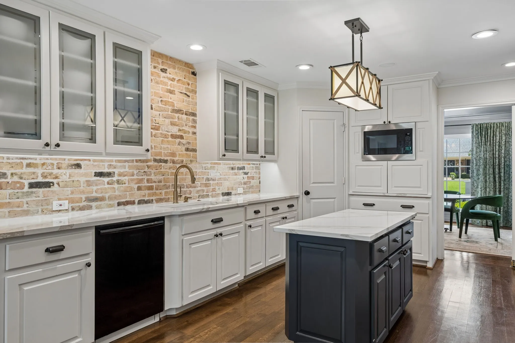 Kitchen with Farm Sink, Built in Microwave and Appliance Cabinet.