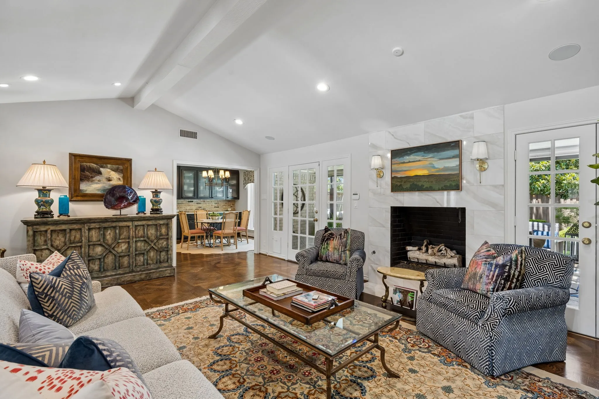 Family Room with two sets of French Doors to Back yard and pool area. Open to Breakfast Room and Kitchen.