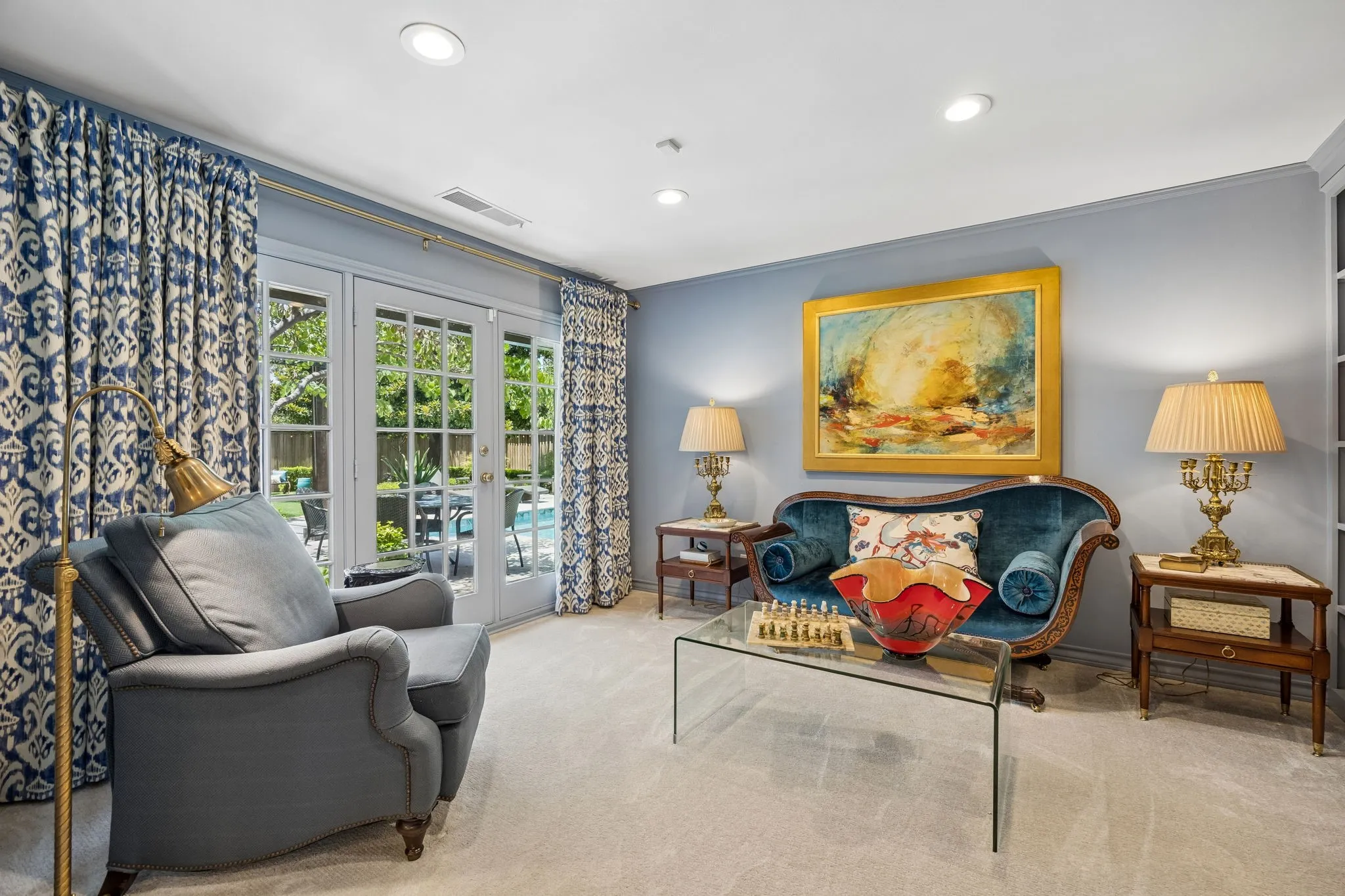 Sitting Room off the Primary Bedroom could be used as home office. French doors to Patio and Pool.