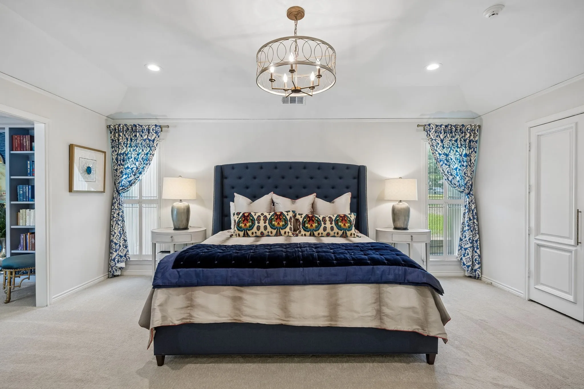 Primary Bedroom with two separate walk in closets and open to sitting area.