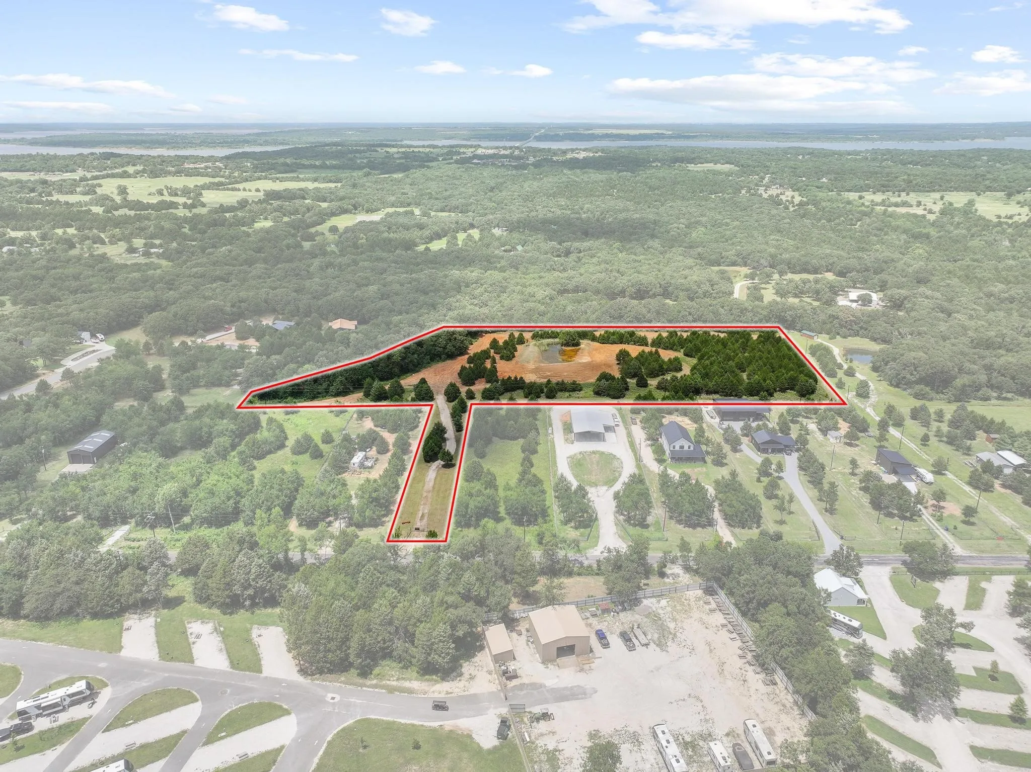 Expansive parcel featuring a mix of cleared land and mature tree coverage