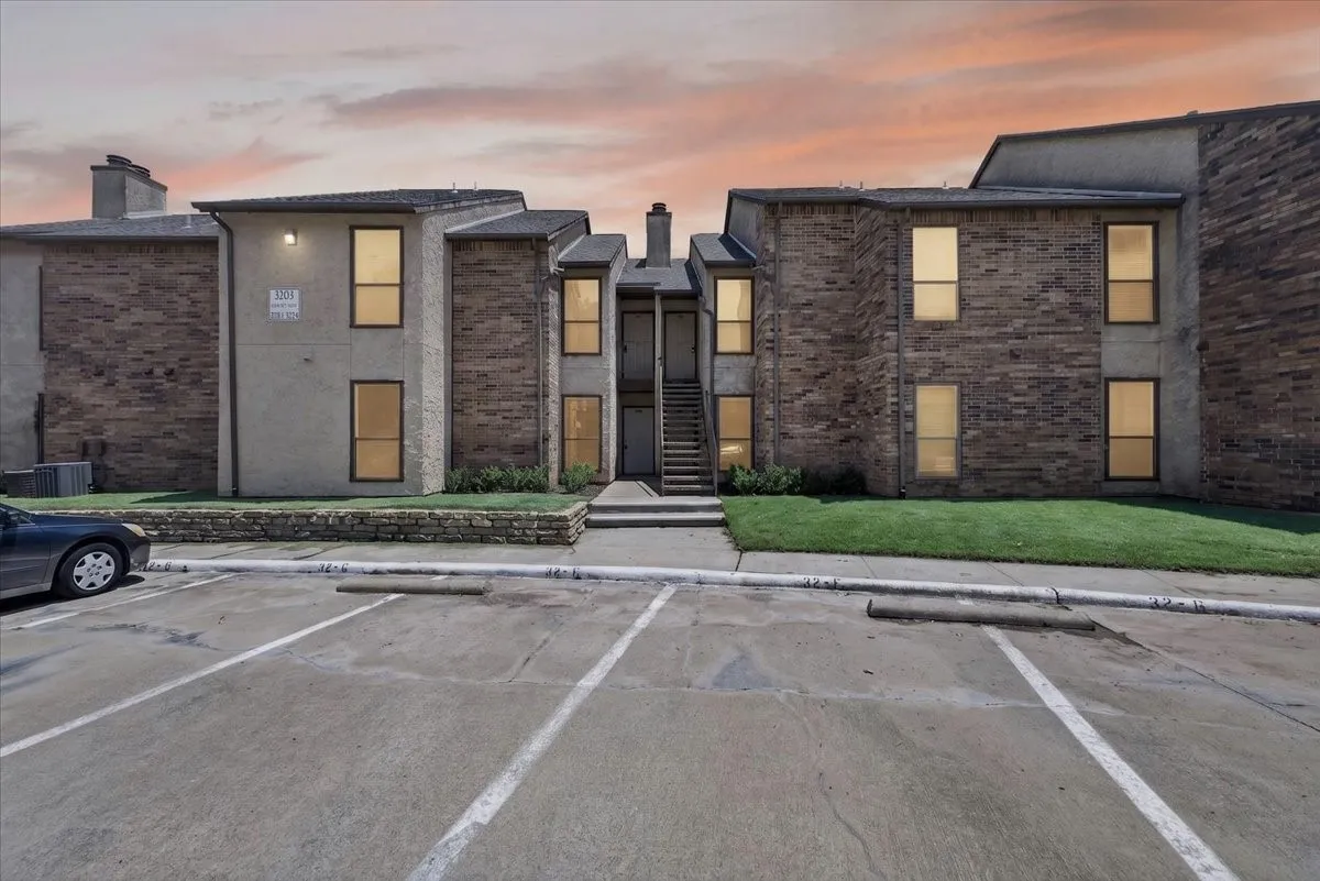 Multi-unit building featuring a brick and stucco exterior