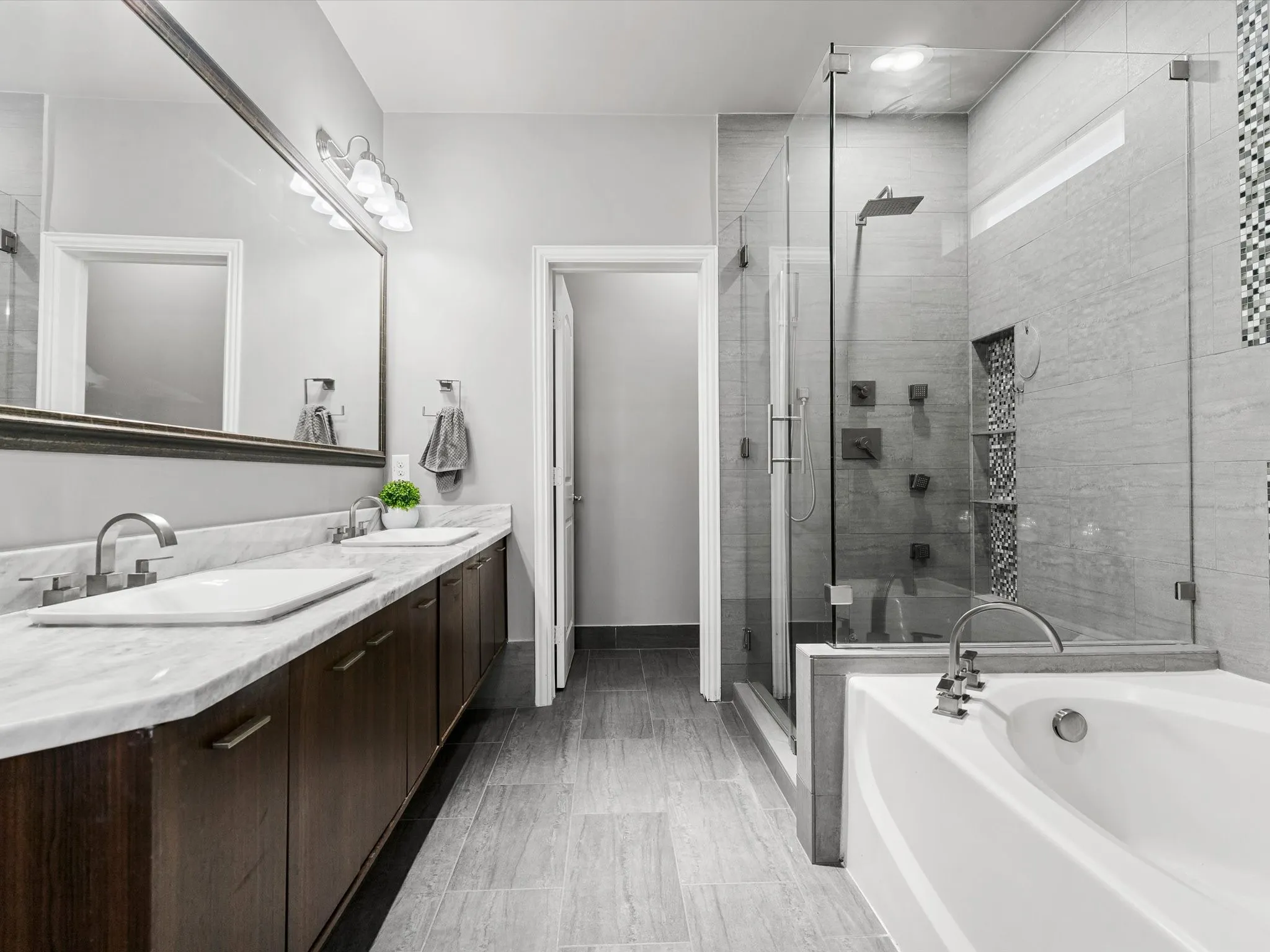 Double vanity with white rectangular sinks and a marble-finish countertop