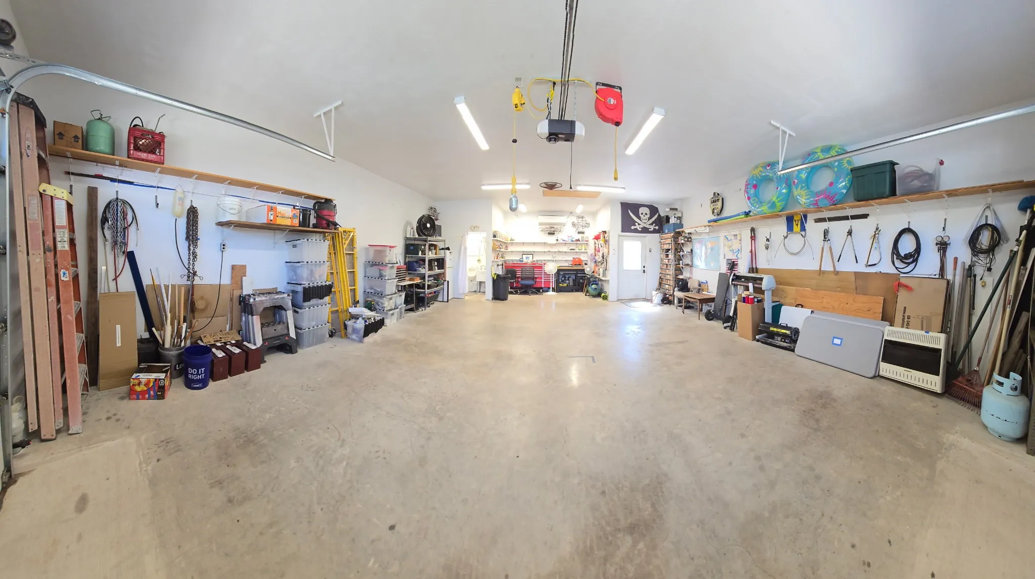 Oversized Garage and Workshop with half bath and Air Conditioning