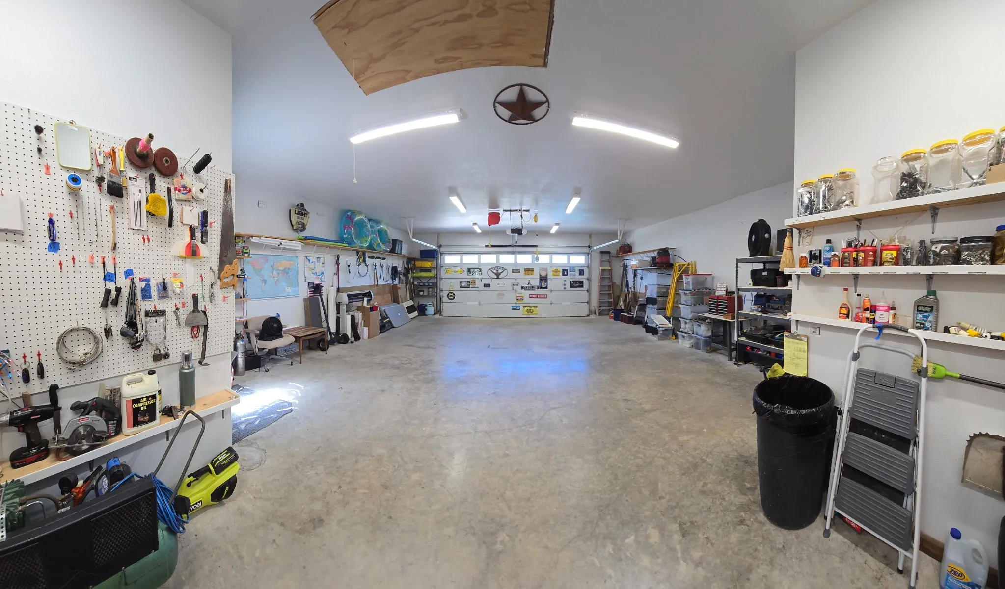 Oversized Garage and Workshop with half bath and Air Conditioning